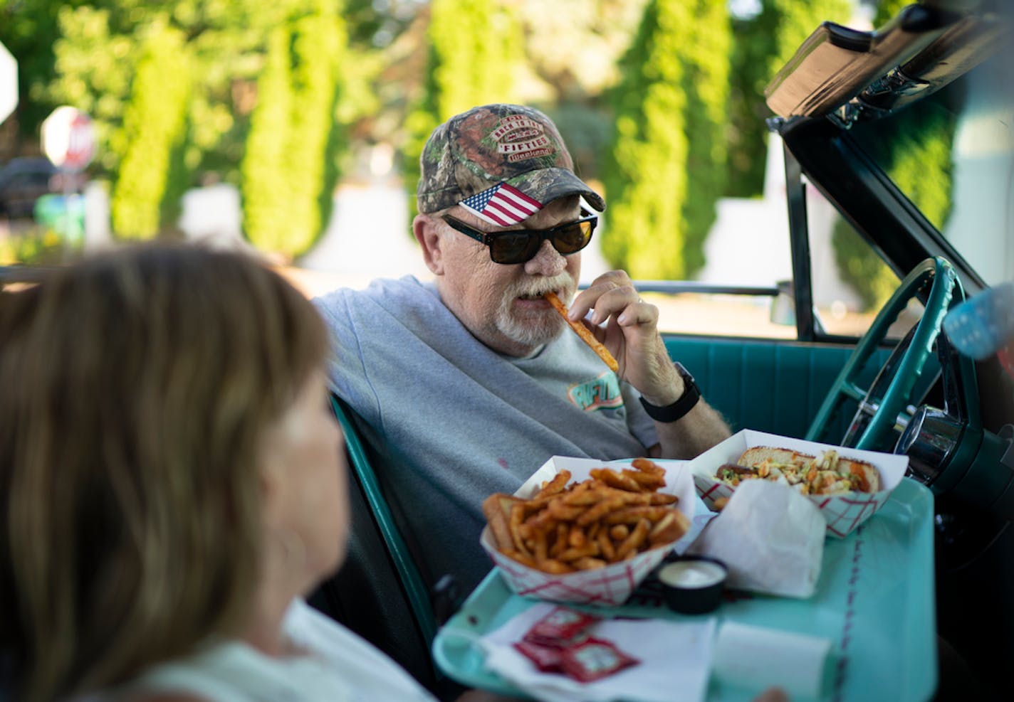 Ralph Stinger bit into his first French fry while dining in his '64 Ford Galaxie 500 with his wife, Bobbi, at Clays Galaxy Drive In.