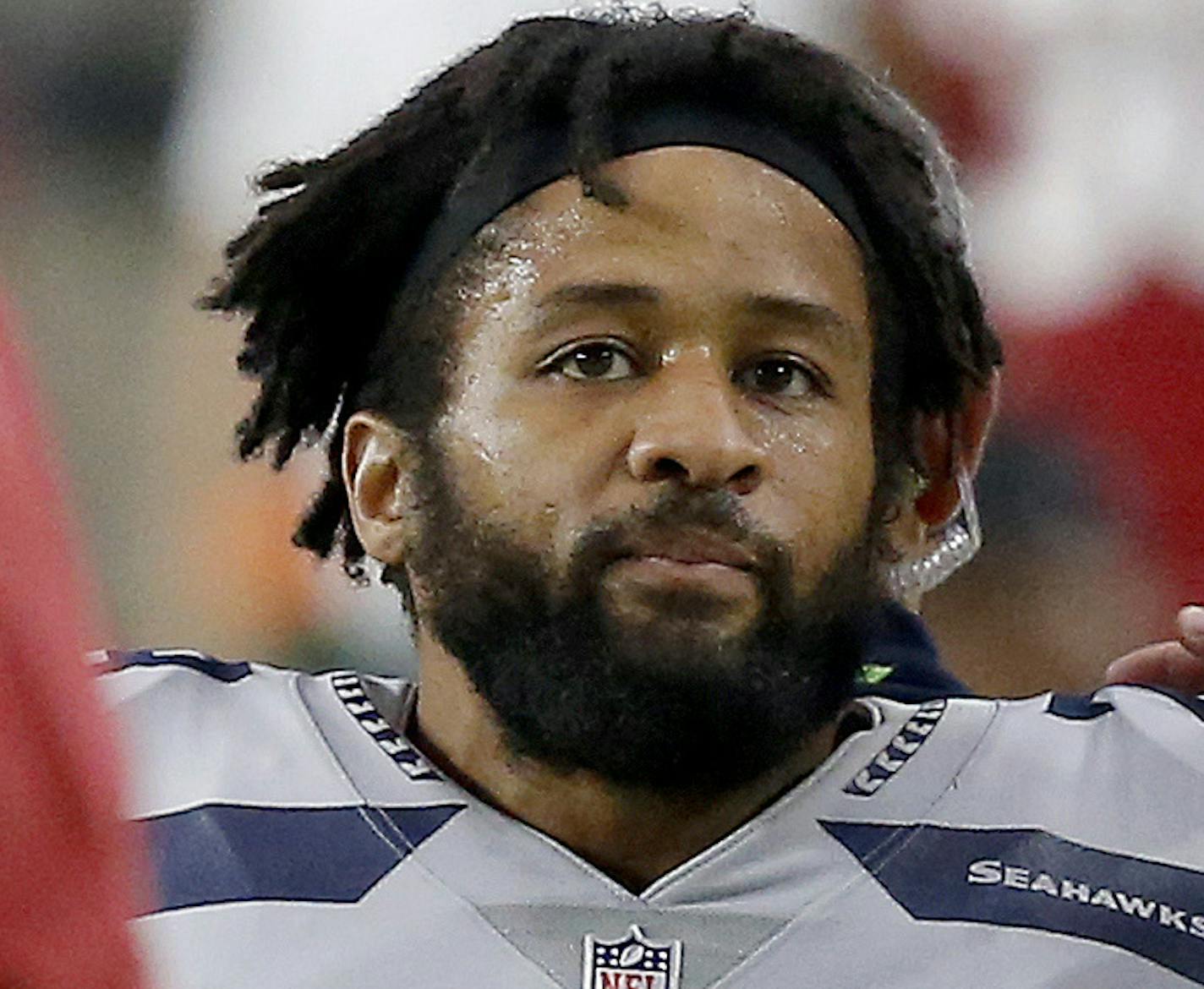 FILE - In this Sept. 30, 2018, file photo, Seattle Seahawks defensive back Earl Thomas (29) is greeted by Arizona Cardinals players as he leaves the field after breaking his leg during the second half of an NFL football game in Glendale, Ariz. The Seahawks won 20-17. The Seahawks face the Los Angeles Rams and running back Todd Gurley this week. (AP Photo/Ross D. Franklin, File) ORG XMIT: NY201