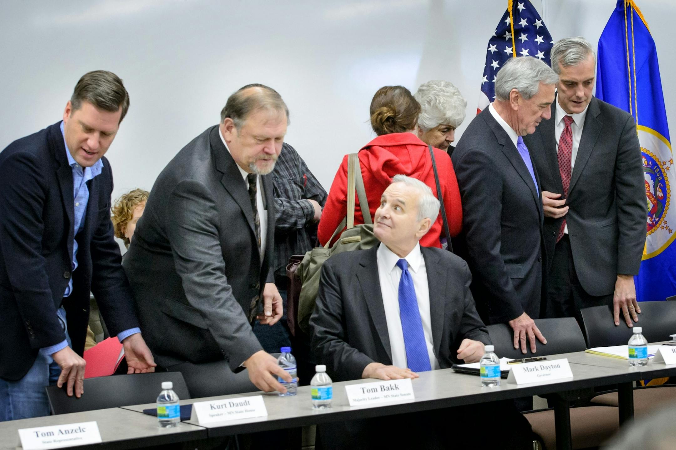 White House chief of staff Denis McDonough, right, talked with U.S. Rick Nolan at the start of the meeting. From the left are House Speaker Kurt Daudt, Senate Majority Leader Tom Bakk, Governor Mark Dayton.
