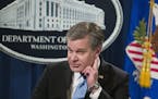 FBI Director Christopher Wray listens to a questions as he speaks during a news conference about the arrest of Cesar Sayoc, 56, of Aventura, Fla., in 