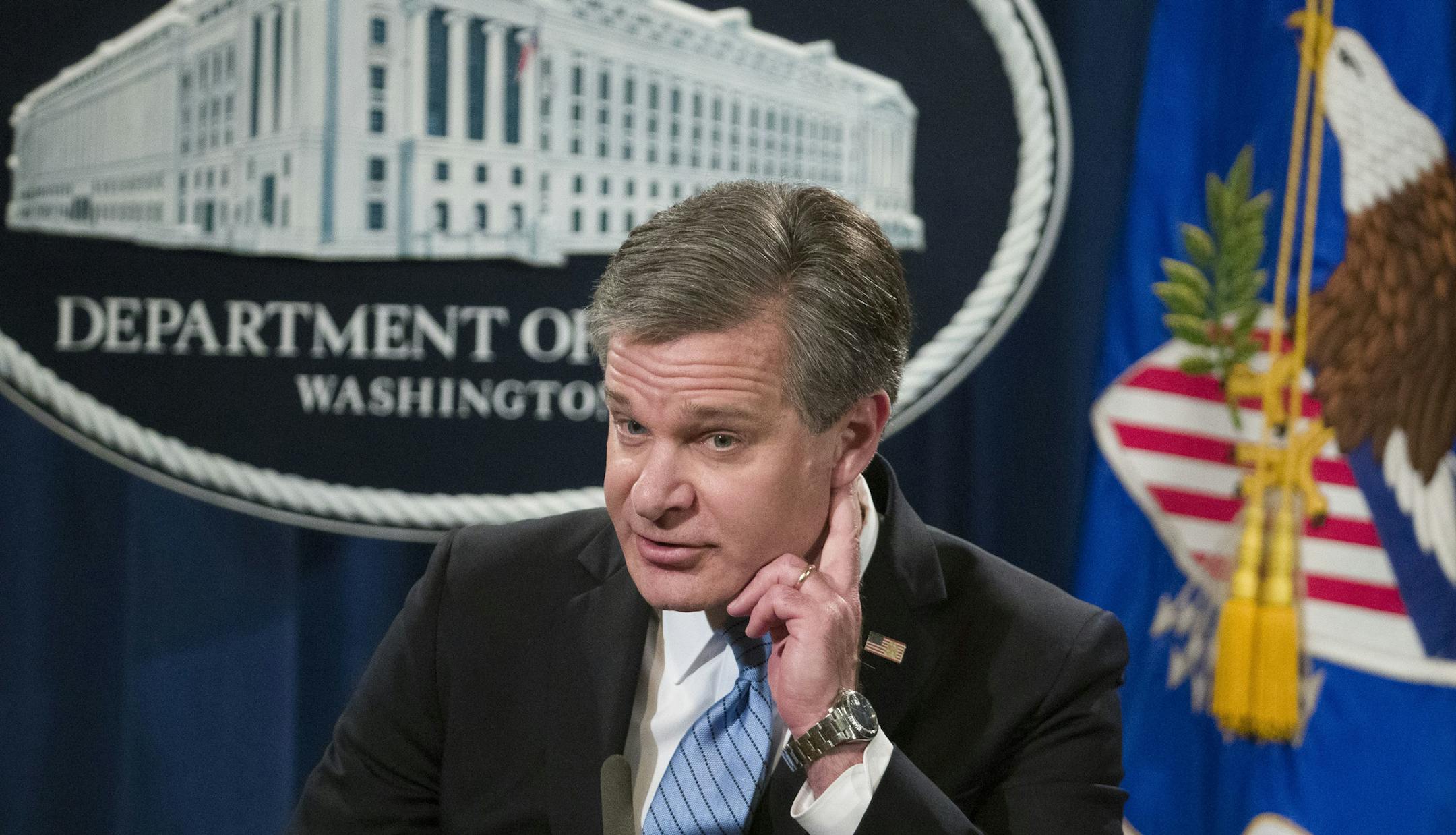 FBI Director Christopher Wray listens to a questions as he speaks during a news conference about the arrest of Cesar Sayoc, 56, of Aventura, Fla., in the package bomb case, at the Department of Justice, Friday, Oct. 26, 2018, in Washington. (AP Photo/Alex Brandon)