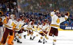 Minnesota Duluth players spilled onto the ice after the Bulldogs defeated Massachusetts 3-0 to win the 2019 NCAA men's hockey championship in Buffalo,