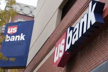 FILE - In this Oct. 20, 2009 file photo, signs on a US Bank branch in Omaha, Neb. are shown Tuesday, Oct. 20, 2009. U.S. Bancorp said Wednesday, Jan. 