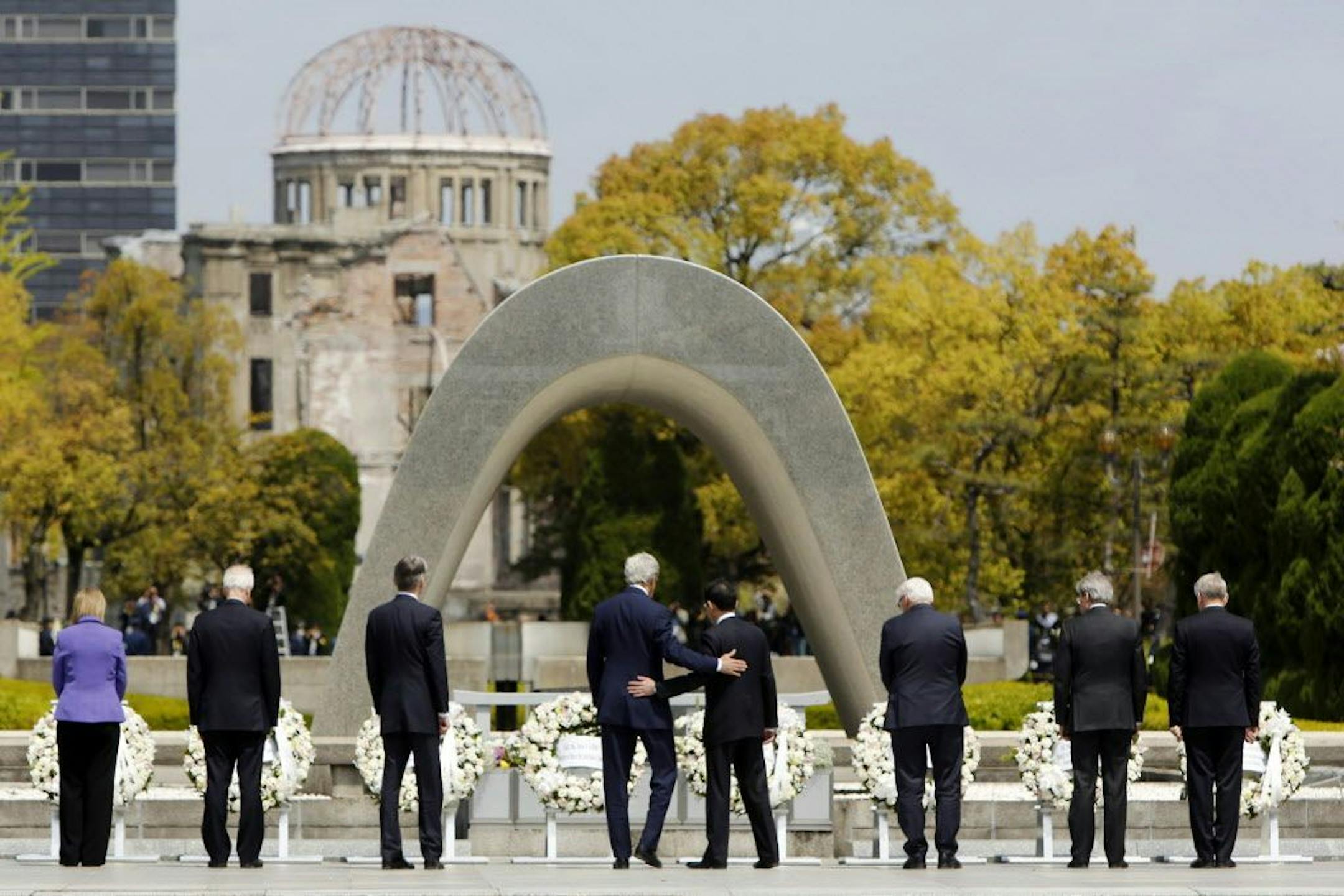 Secretary of State John Kerry, fourth from left, with Japan's foreign minister, Fumio Kishida, after laying wreaths at the Peace Memorial Park in Hiroshima, Japan in April.