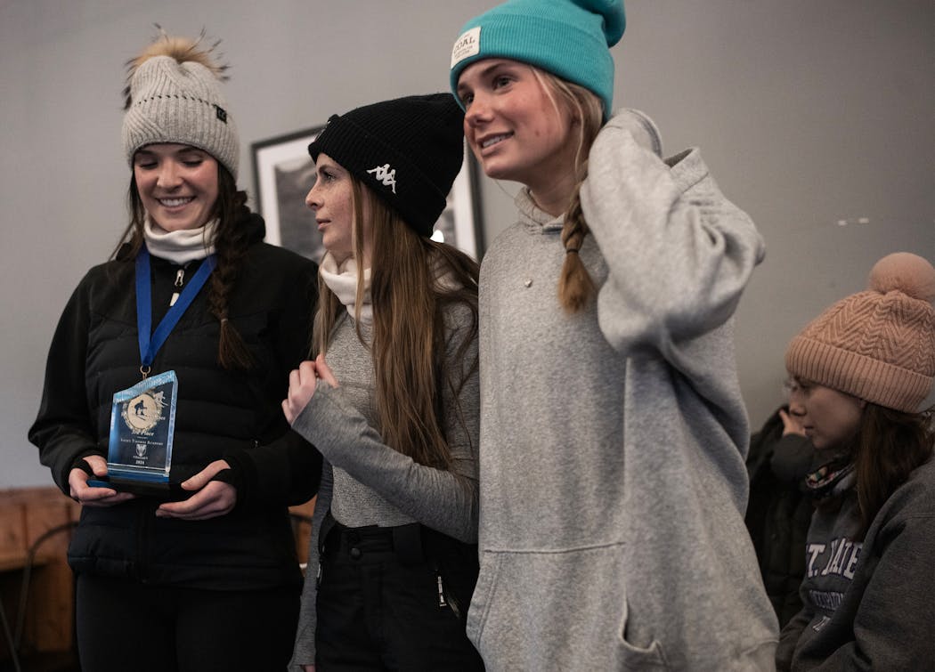 Kate Reardon, far left, of Hill-Murray stood with her trophy after taking first place in the girls competition at Wild Mountain in Taylors Falls in January.