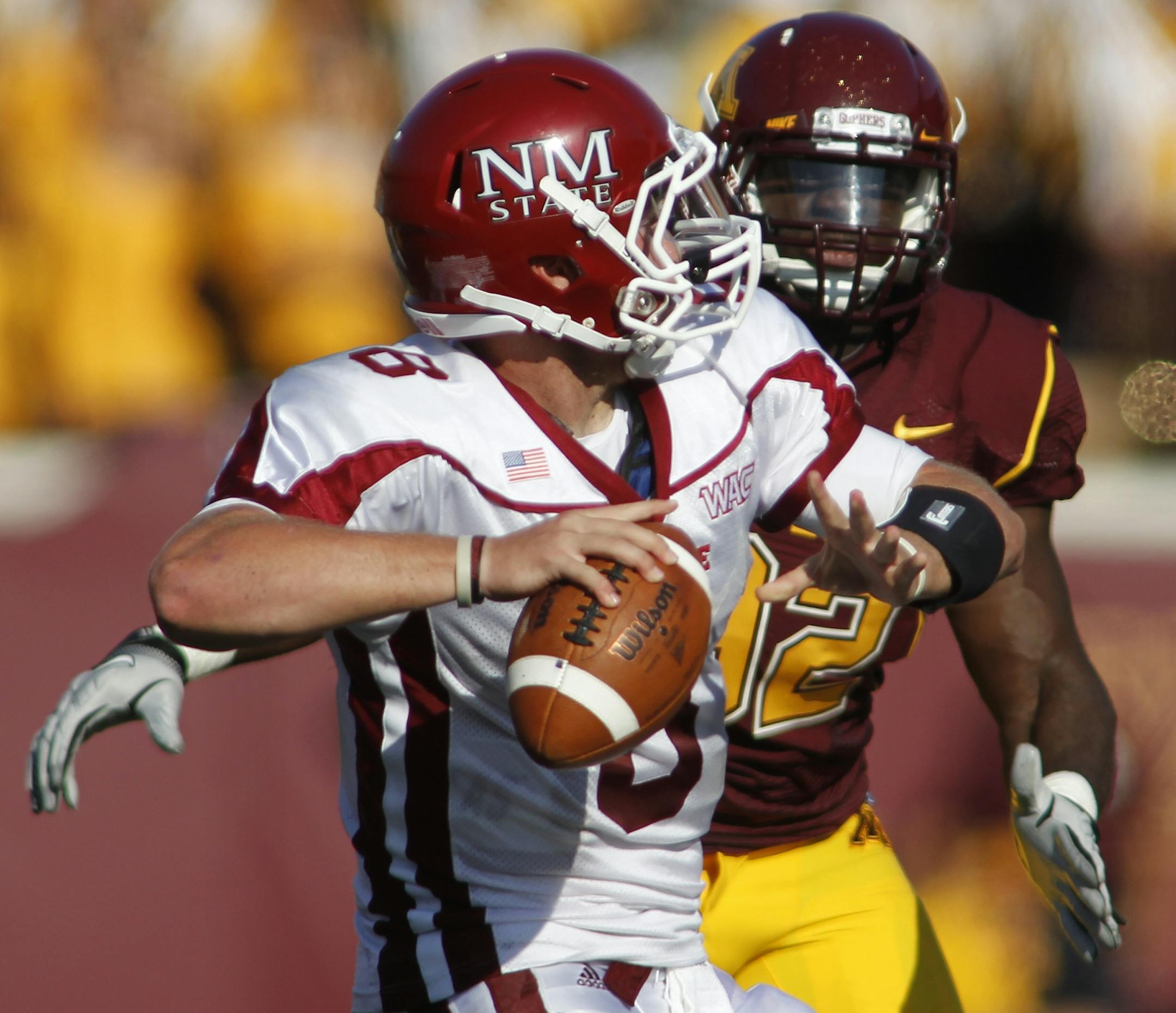 University of Minnesota vs. New Mexico State football. New Mexico State won 28-21. New Mexico Atate quarterback Andrew Manley threw downfield.