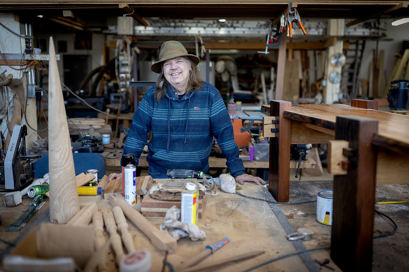 Woodworker Tom Guelcher shares how he found a bottle of whiskey that he had hidden many years ago in a porch in Minneapolis, Minn., on Friday, Dec. 1, 2023. Guelcher, owner of Turning Point Woodwork, was rebuilding a porch on an old house in St. Paul when something unexpected fell out of a hollow wooden column. It was an old, unopened bottle of whisky that he must have stashed there years ago. ] Elizabeth Flores • liz.flores@startribune.com