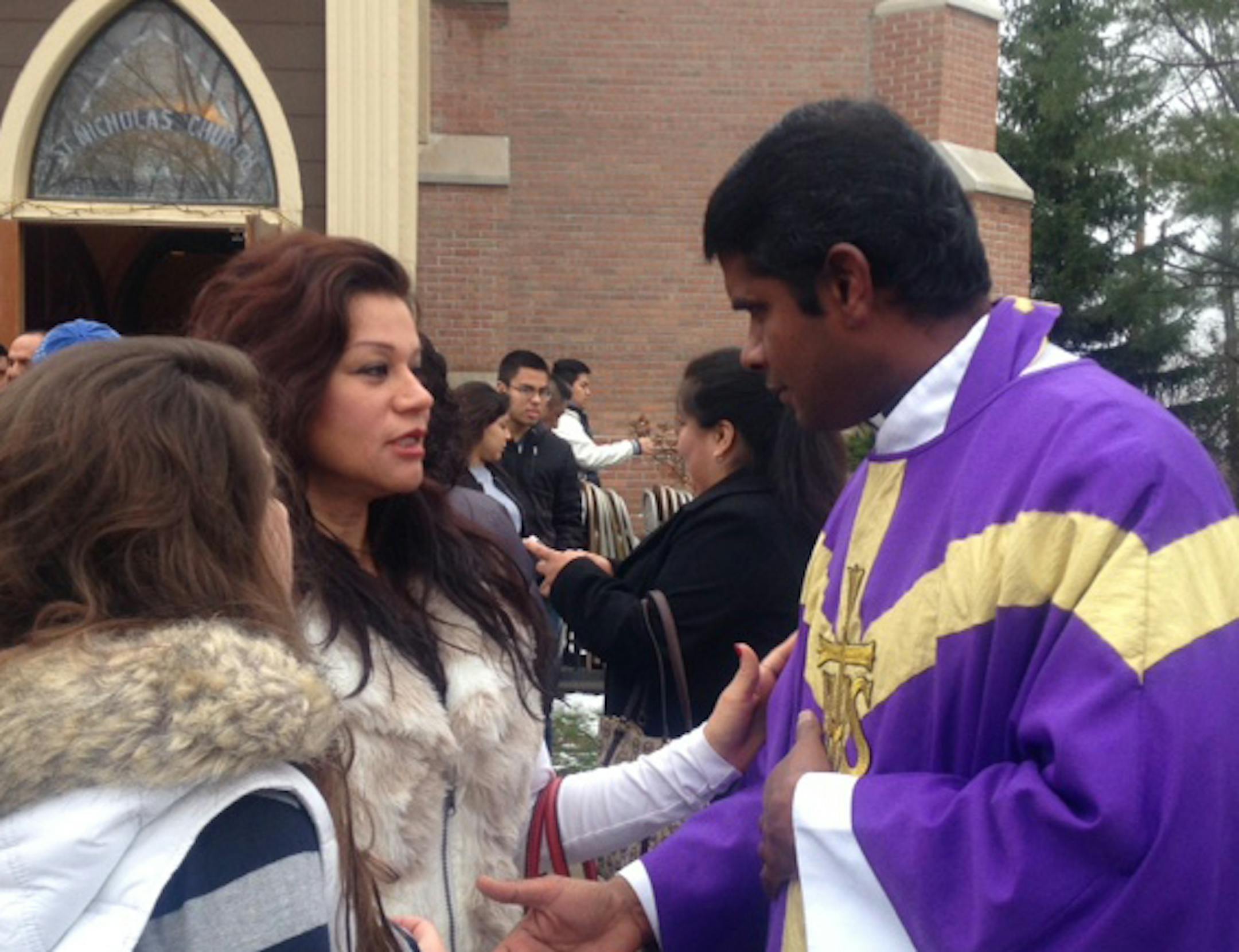 Father Thomas Joseph talks with a parishioner after the noon mass for Spanish speakers on Dec. 4. (Getting name)
credit: Erin Adler/Star Tribune