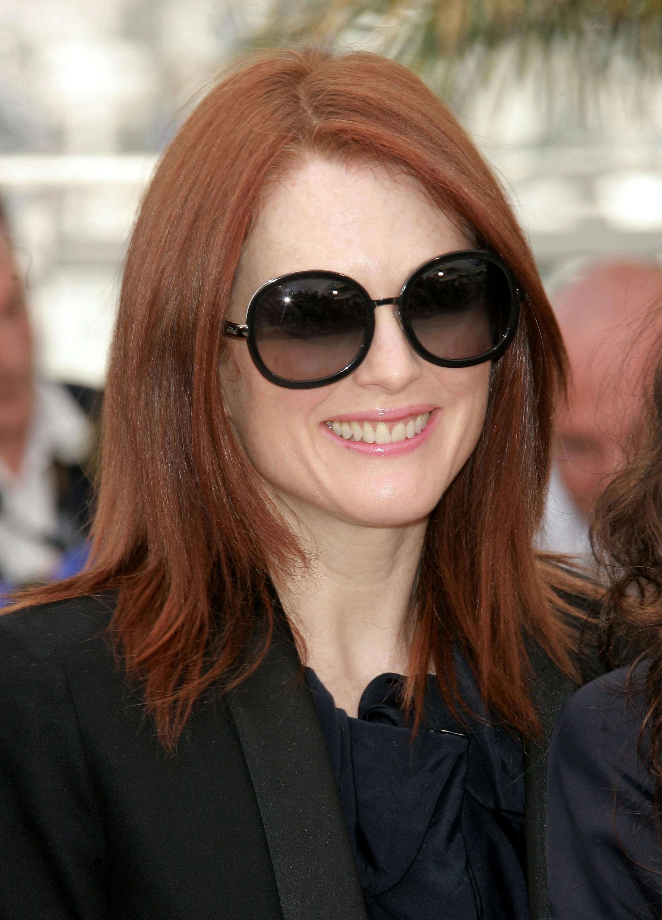 This May 14, 2008 file photo shows actress Julianne Moore as she poses during a photo call for the film "Blindness" at the 61st International film festival in Cannes, southern France. All those celebrities in oversized sunglasses might be doing more than shielding themselves from the paparazzi: Large lenses, especially those that fit the contours of the face, provide better protection from the sun's rays.
