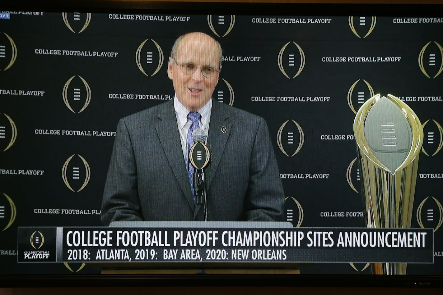 Bill Hancock, the College Football Playoff executive director, was shown on a big screen as he announced the, 2018, 2019 and 2020 College Football Playoff Championship Game venues. Minneapolis was not among the cities chosen to host.