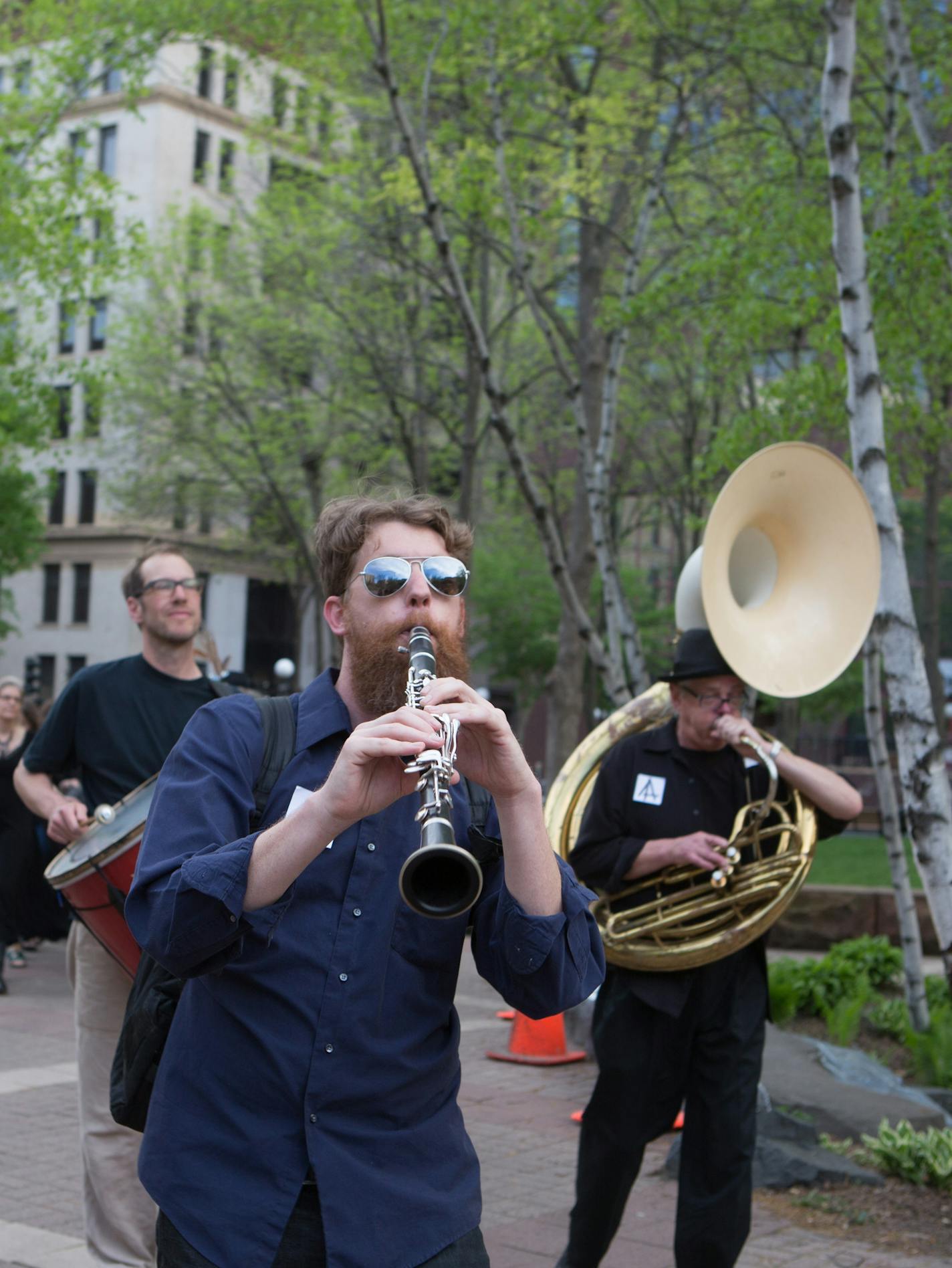 Former Jax building tenants and lower town arts supporters hold a wake to honor their longtime artistic quarters. Funeral began at Union Depot and then proceeded to the Jax building] Elizabeth Brumley special to the Star Tribune * Former and soon-to-be-former residents of the Jax Building in downtown St. Paul hold a Friday night "wake" for this longtime hub of artistic expression that will soon become slick new housing and comercial space that is so popular in increasingly popular Lowertown. We