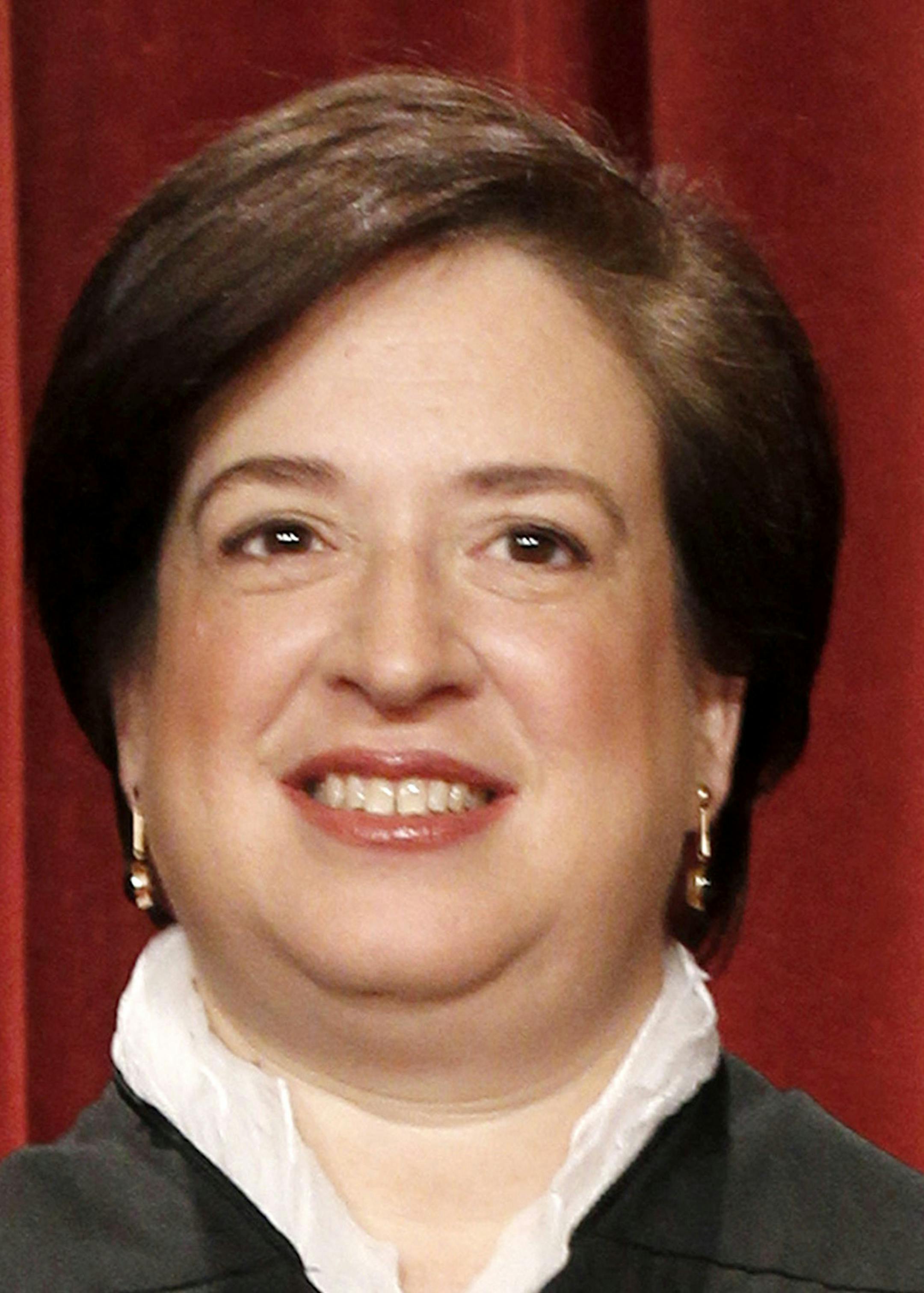 FILE - In this Oct. 8, 2010, file photo the Supreme Court's newest member, Associate Justice Elena Kagan, is seen during a group portrait at the Court in Washington. Conservative interest groups and Republican lawmakers want Justice Kagan off the health care case. Liberals and Democrats in Congress say it's Justice Clarence Thomas who should sit it out. Neither justice is budging ó the right decision, according to many ethicists and legal experts. (AP Photo/Pablo Martinez Monsivais, File) O