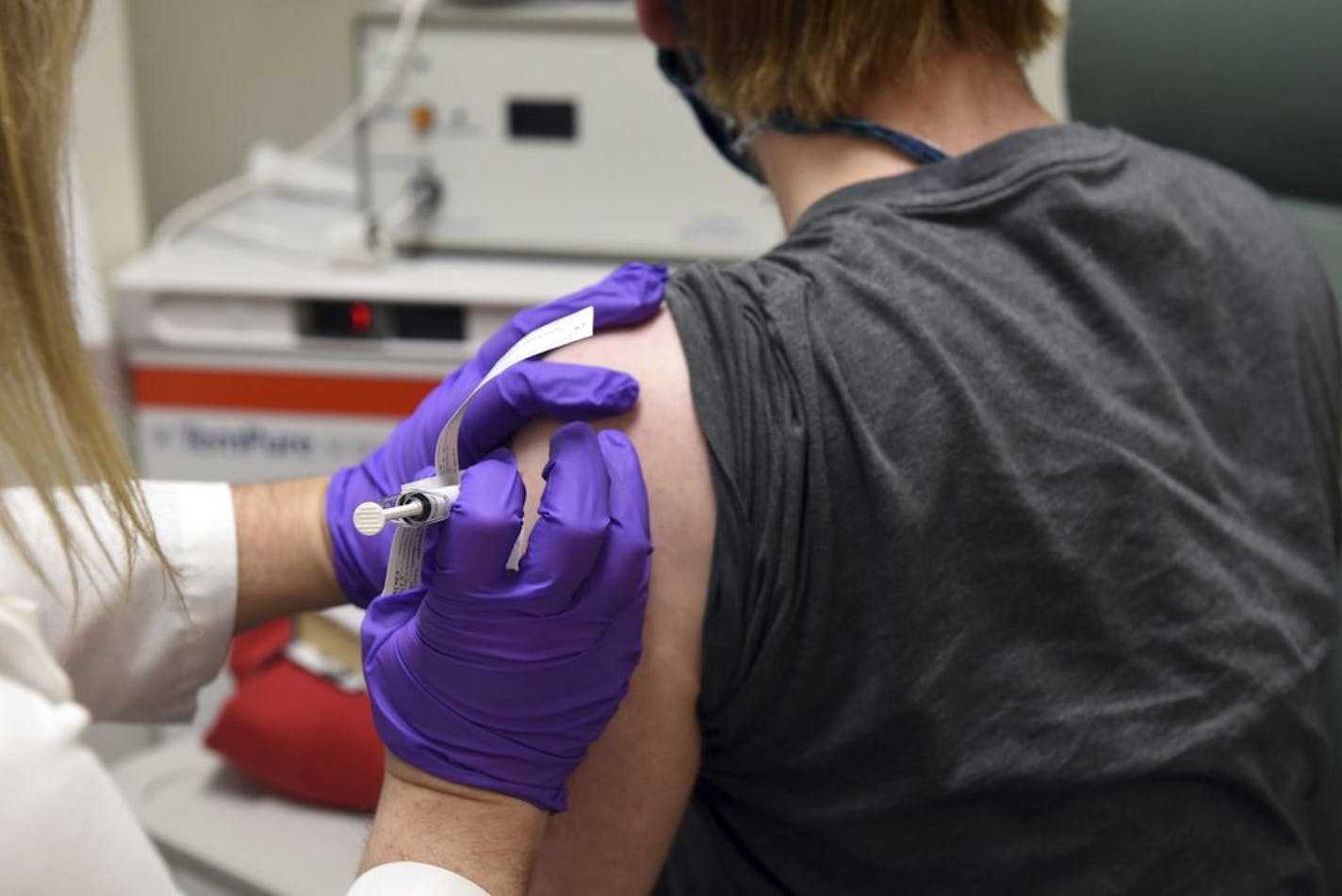 This May 2020 file photo shows the first patient enrolled in Pfizer's COVID-19 coronavirus vaccine clinical trial at the University of Maryland School of Medicine in Baltimore.