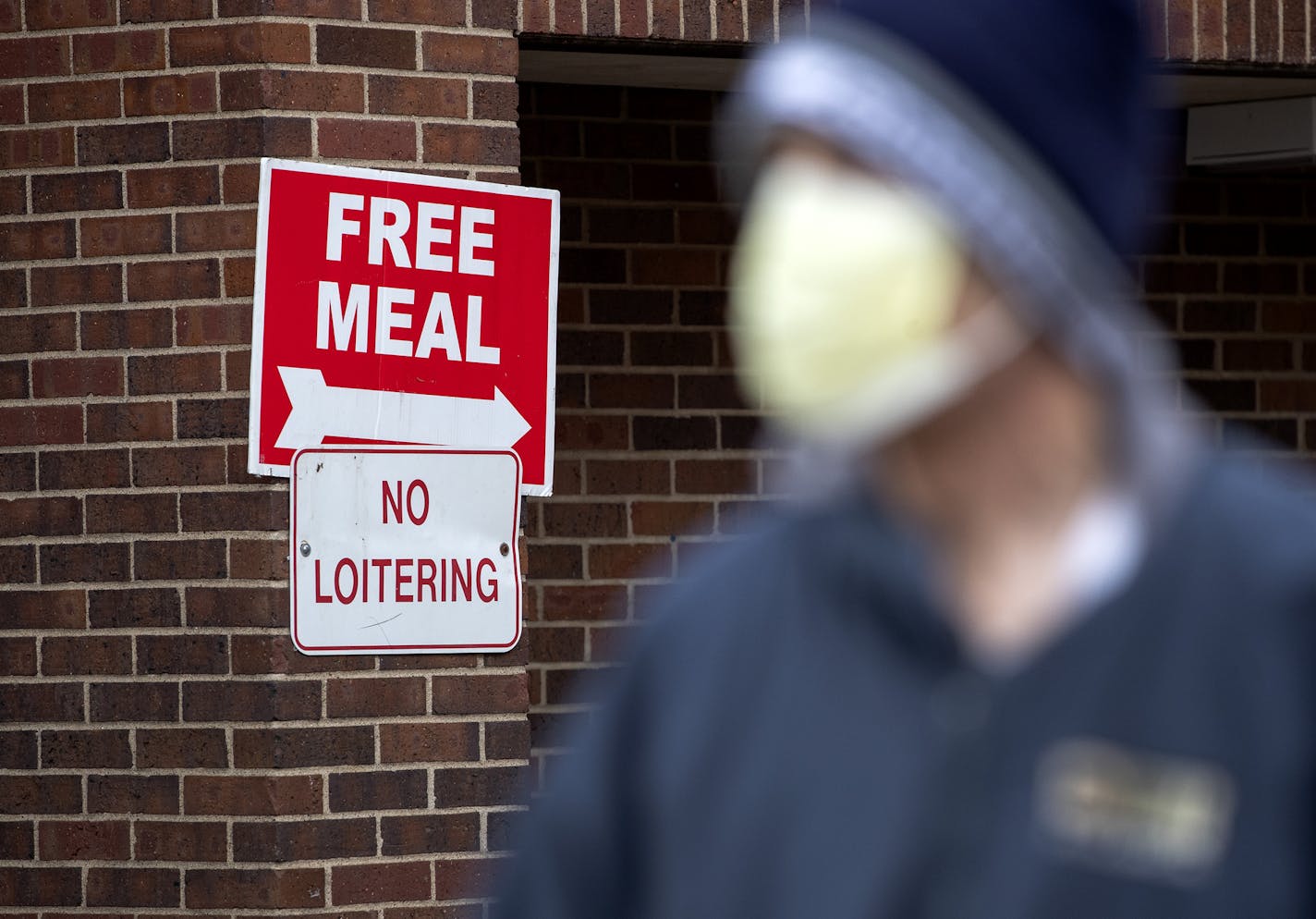 John Teipel, 54, of St. Paul picked up a meal from St Matthew's Catholic Church. ] CARLOS GONZALEZ • cgonzalez@startribune.com – St. Paul, MN – April 14, 2020, Food shelves across Minnesota are ground zero during the economic downturn caused by the COVID-19 / coronavirus outbreak, with food shelves reporting double or triple the number of people in need. John Teipel, 54, of St. Paul