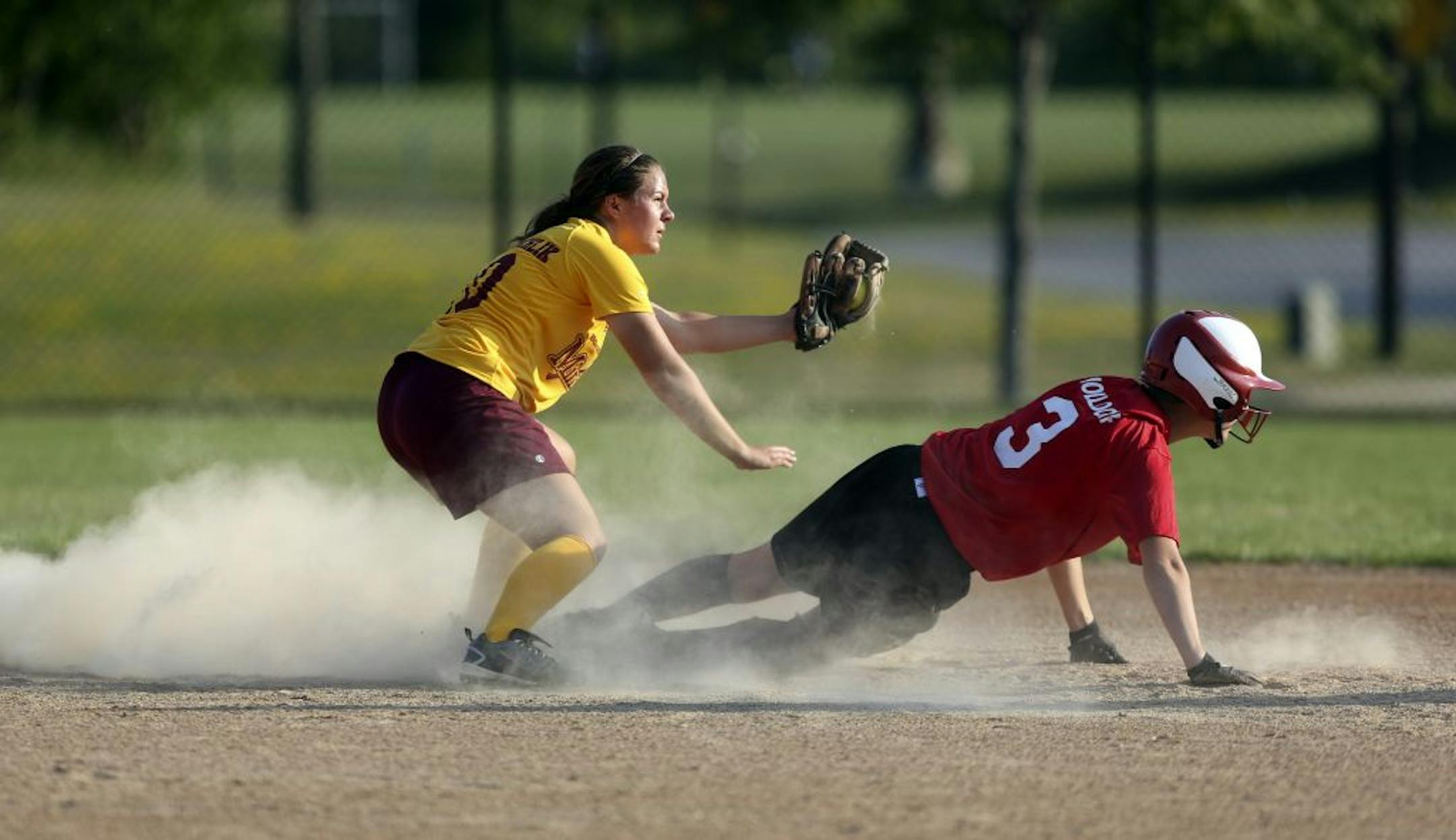 Stillwater's Allison Eder-Zdechlik showed the umpire the ball after tagging out Wisconsin's Emily Holldorf during the Border Battle all- star doubleheader against Wisconsin on July 11. Photo by Kyndell Harkness • kharkness@startribune.com