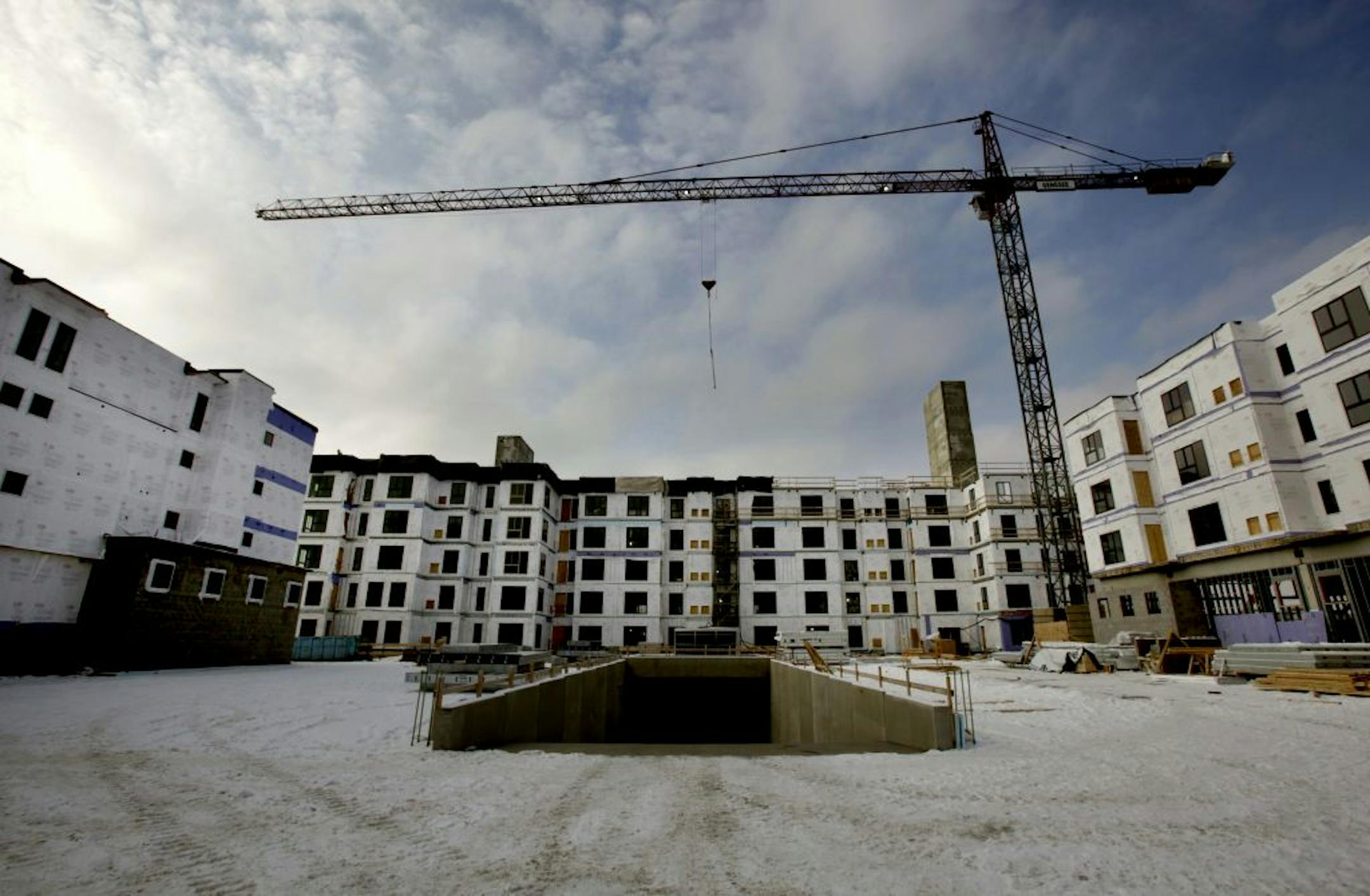 Genessee Apartments, the complex under construction at the site of a former car dealership on Penn Avenue in Bloomington, is one of the latest developments from StuartCo.