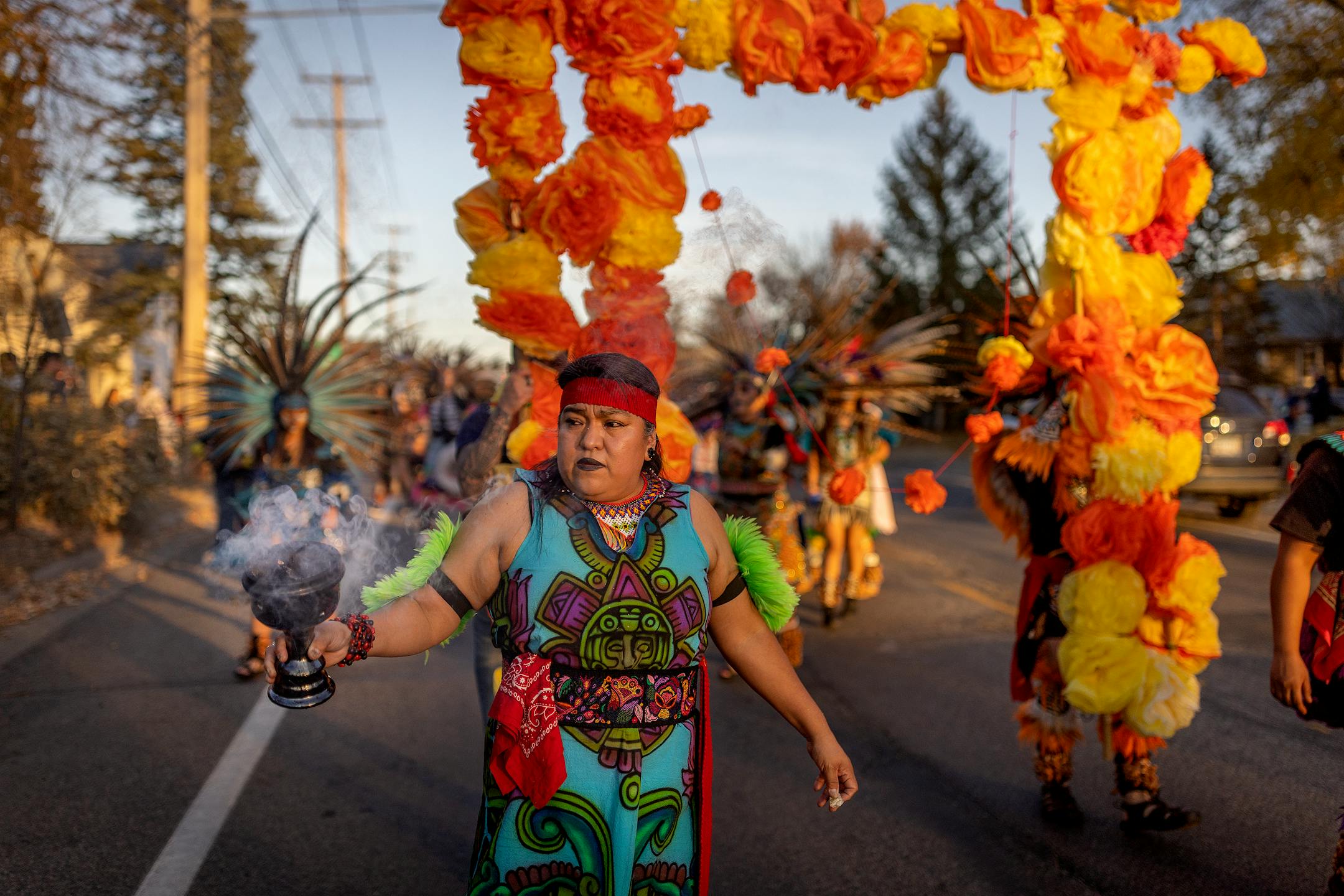 Aide Quezada with Kapuli KetzalCoatilcue dance company, leads a procession to begin the Dia De Los Muertos Celebration held at El Colegio High School.