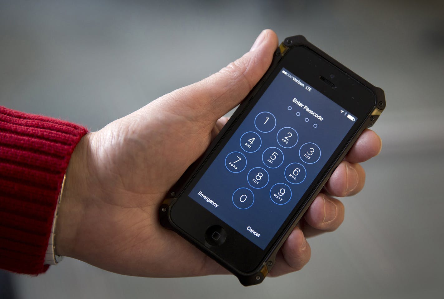 An iPhone is seen in Washington, Wednesday, Feb. 17, 2016. A U.S. magistrate judge has ordered Apple to help the FBI break into a work-issued iPhone used by one of the two gunmen in the mass shooting in San Bernardino, California, a significant legal victory for the Justice Department in an ongoing policy battle between digital privacy and national security. Apple CEO Tim Cook immediately objected, setting the stage for a high-stakes legal fight between Silicon Valley and the federal government.