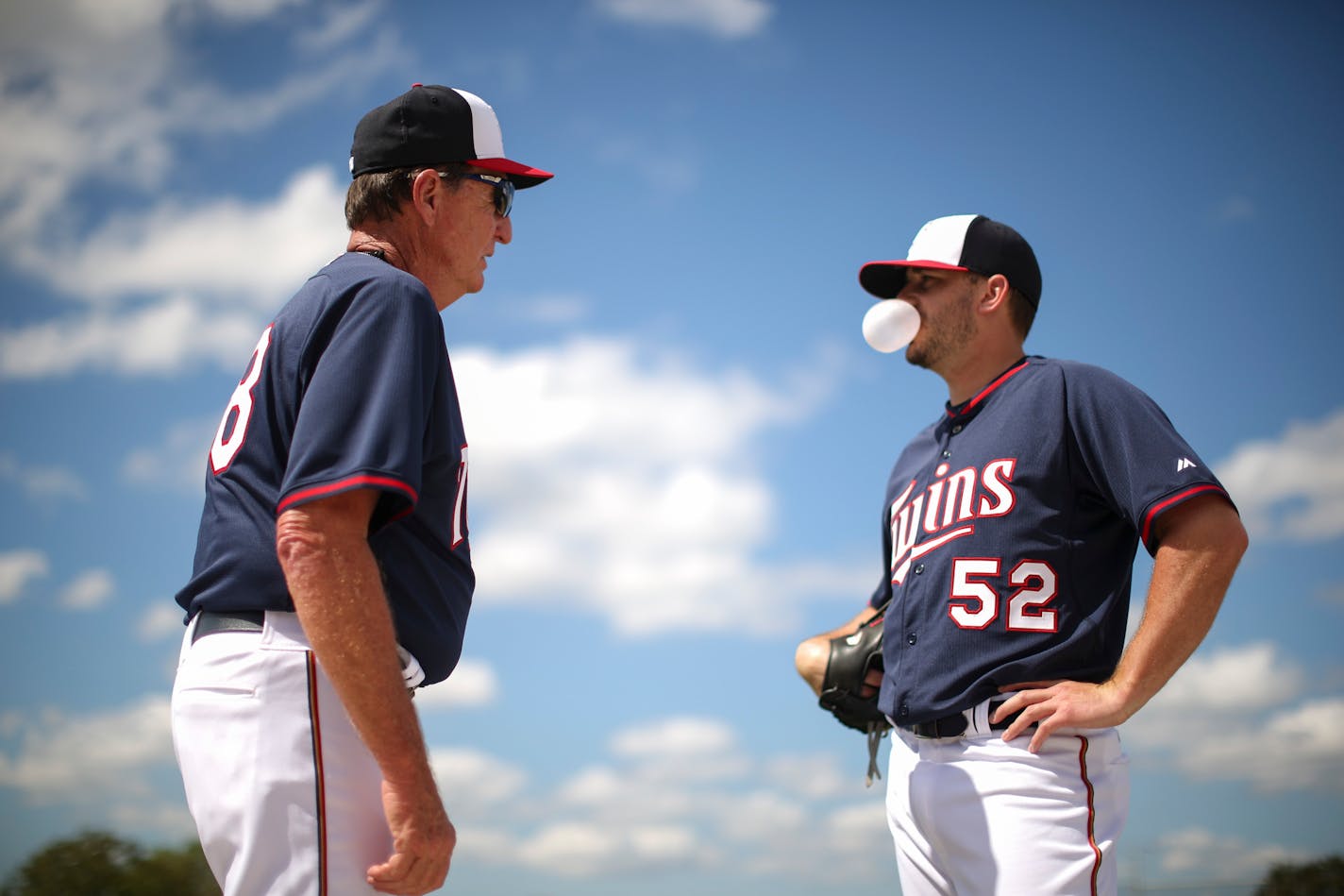 Twins pitcher Brian Duensing talked with coach Eric Rasmussen, the team's minor league pitching coordinator, Tuesday afternoon at Hammond Stadium. ] JEFF WHEELER � jeff.wheeler@startribune.com The Twins held another spring training workout Tuesday morning, March 3, 2015, at Hammond Stadium in Fort Myers, FL.