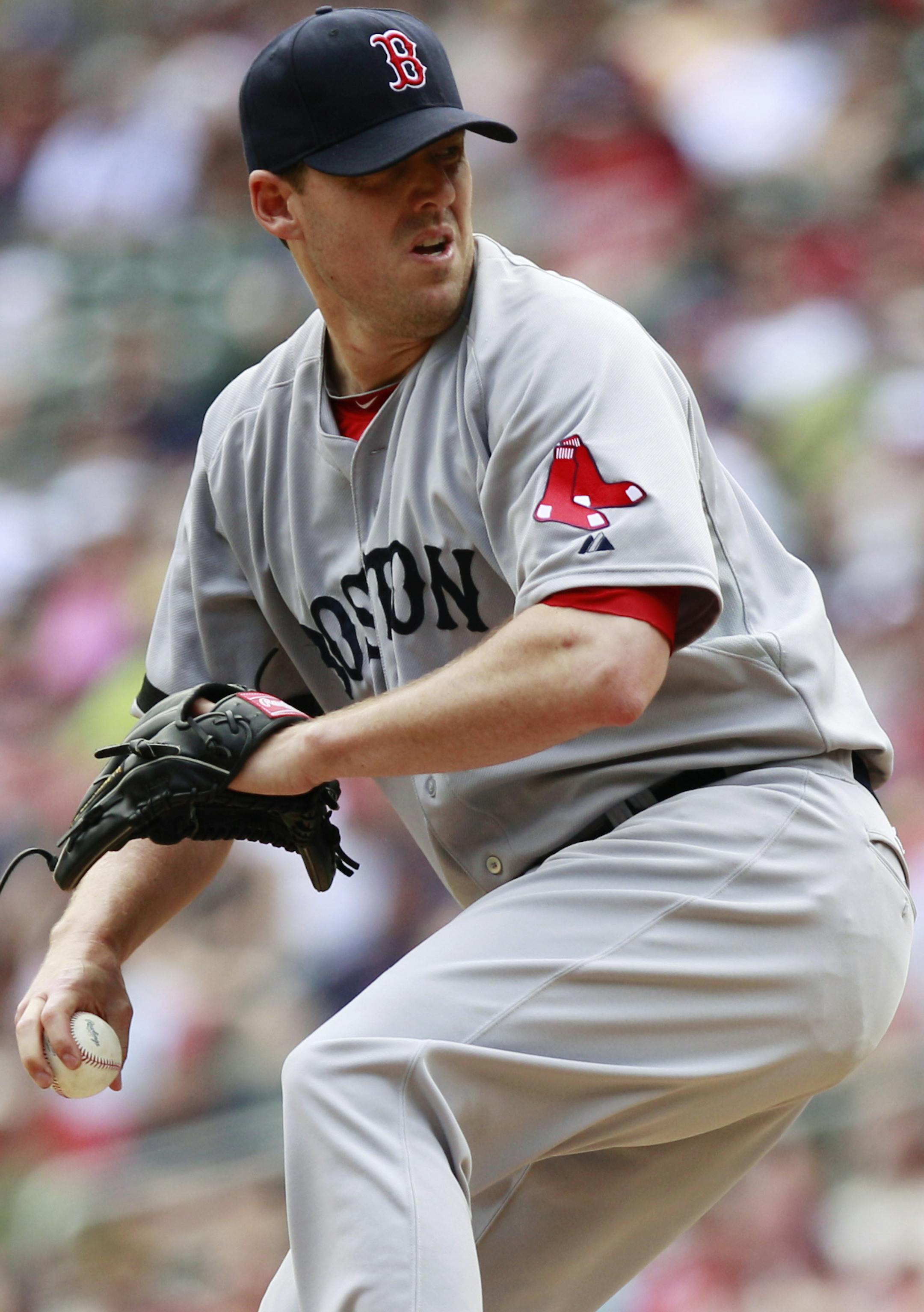 Boston Red Sox starting pitcher John Lackey (41) throws against the Minnesota Twins during the inning inning of a baseball game, Sunday, May 19, 2013, in Minneapolis. (AP Photo/Genevieve Ross)