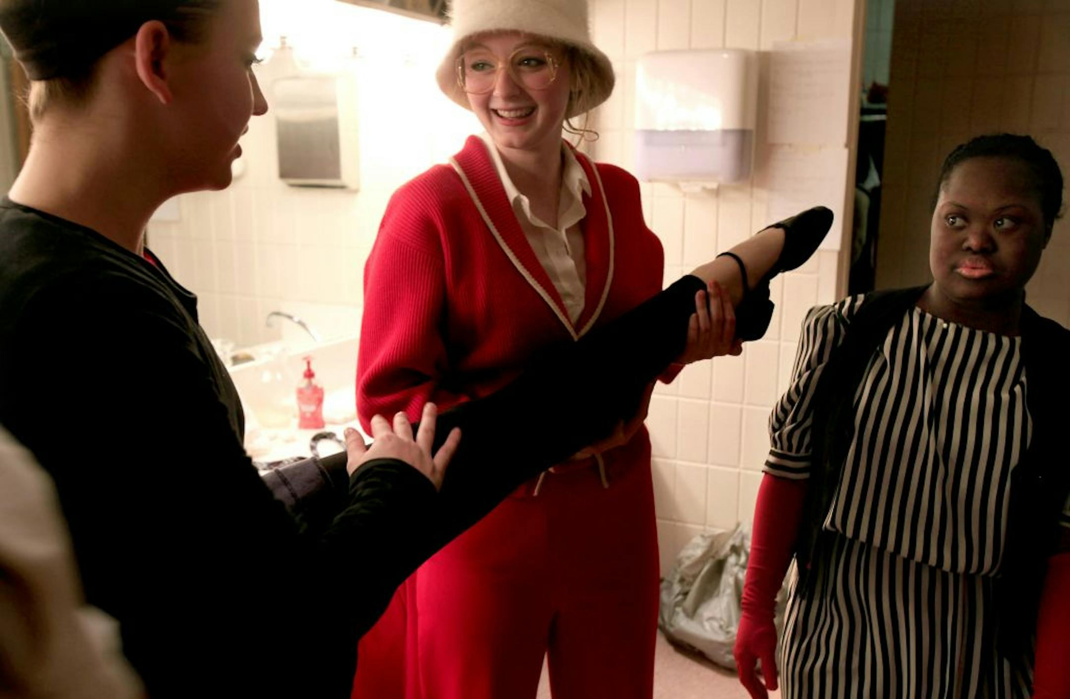Actors get dressed for their rehersal at Visitation High School who are putting on a play at school in conjunction with Interact Center for the Arts, a theater company that helps disabled people perform. Mendota Heights, MN on January 30, 2013.