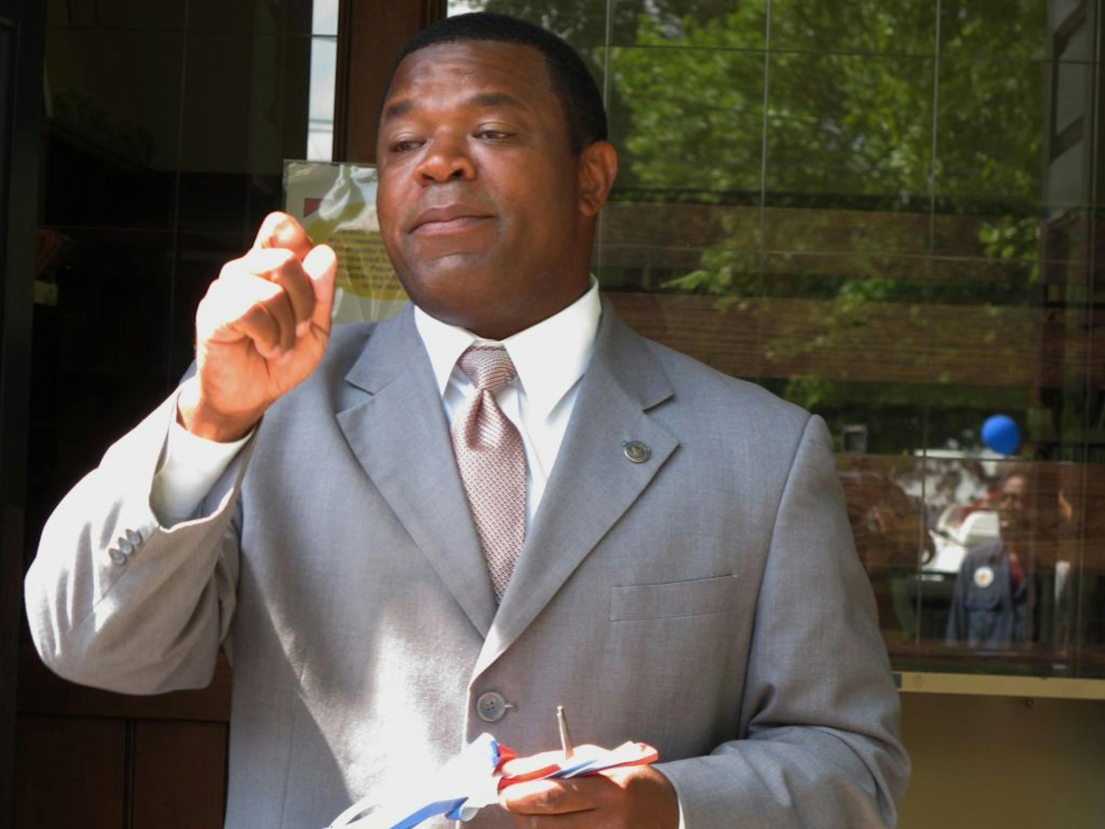 Trenton Mayor Tony Mack takes questions about an FBI investigation during a ceremony to open a new community learning center in Trenton, N.J. on Monday, July 30, 2012. Trenton City Hall and Mack's home were raided by FBI agents in July.