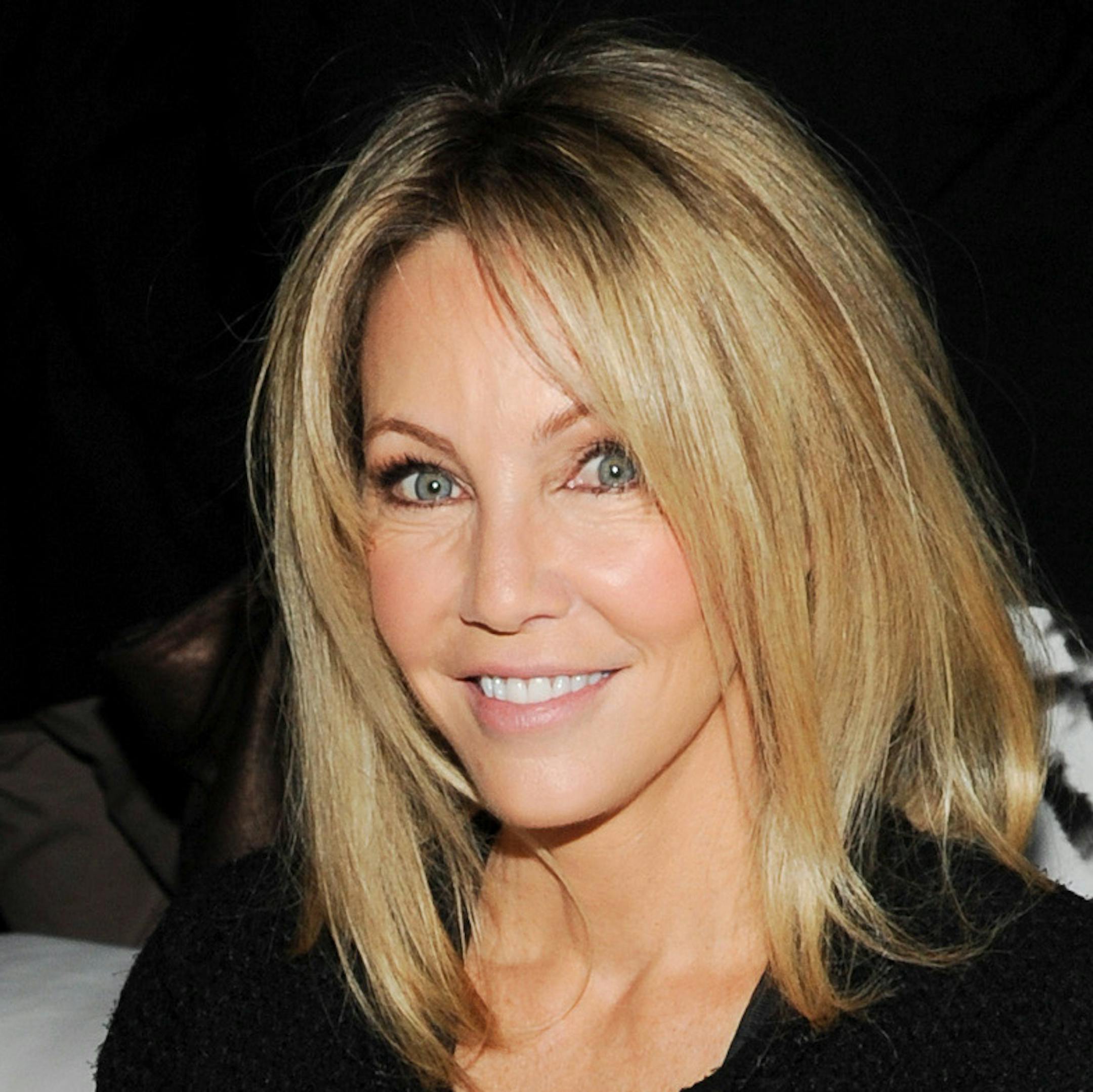 Actress Heather Locklear attends the TNT and TBS 2013 Upfront at the Hammerstein Ballroom on Wednesday, May 15, 2013 in New York. (Photo by Evan Agostini/Invision/AP) ORG XMIT: MIN2013061113203661