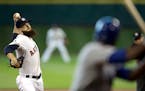 Astros starter Dallas Keuchel threw to the Royals' Lorenzo Cain during the first inning of Game 3 of the ALDS on Sunday. Keuchel pitched seven gutsy i