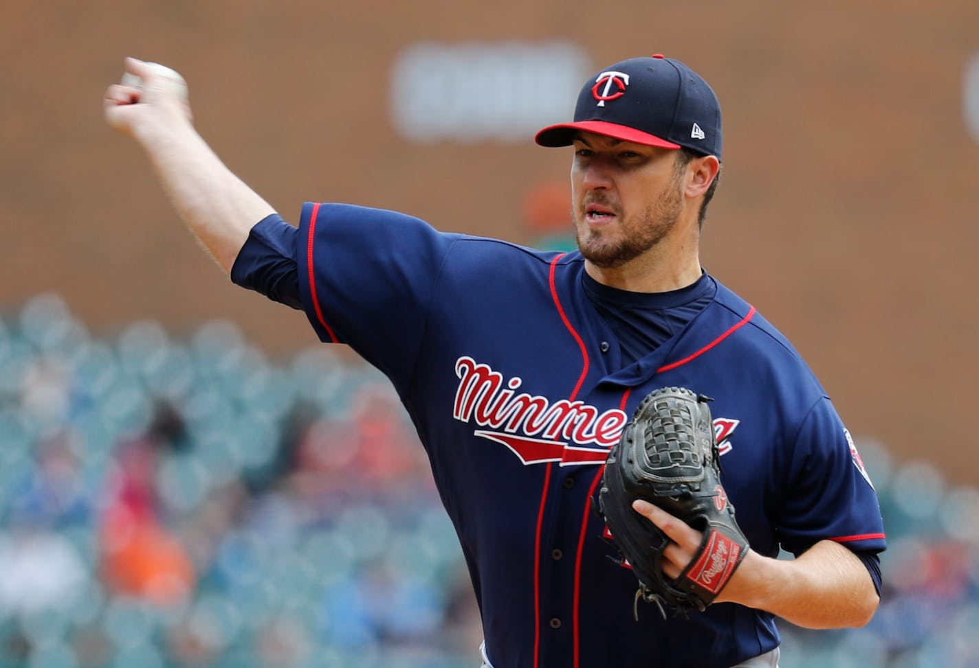 Minnesota Twins pitcher Phil Hughes throws against the Detroit Tigers in the third inning of a baseball game in Detroit, Thursday, April 13, 2017. (AP Photo/Paul Sancya)