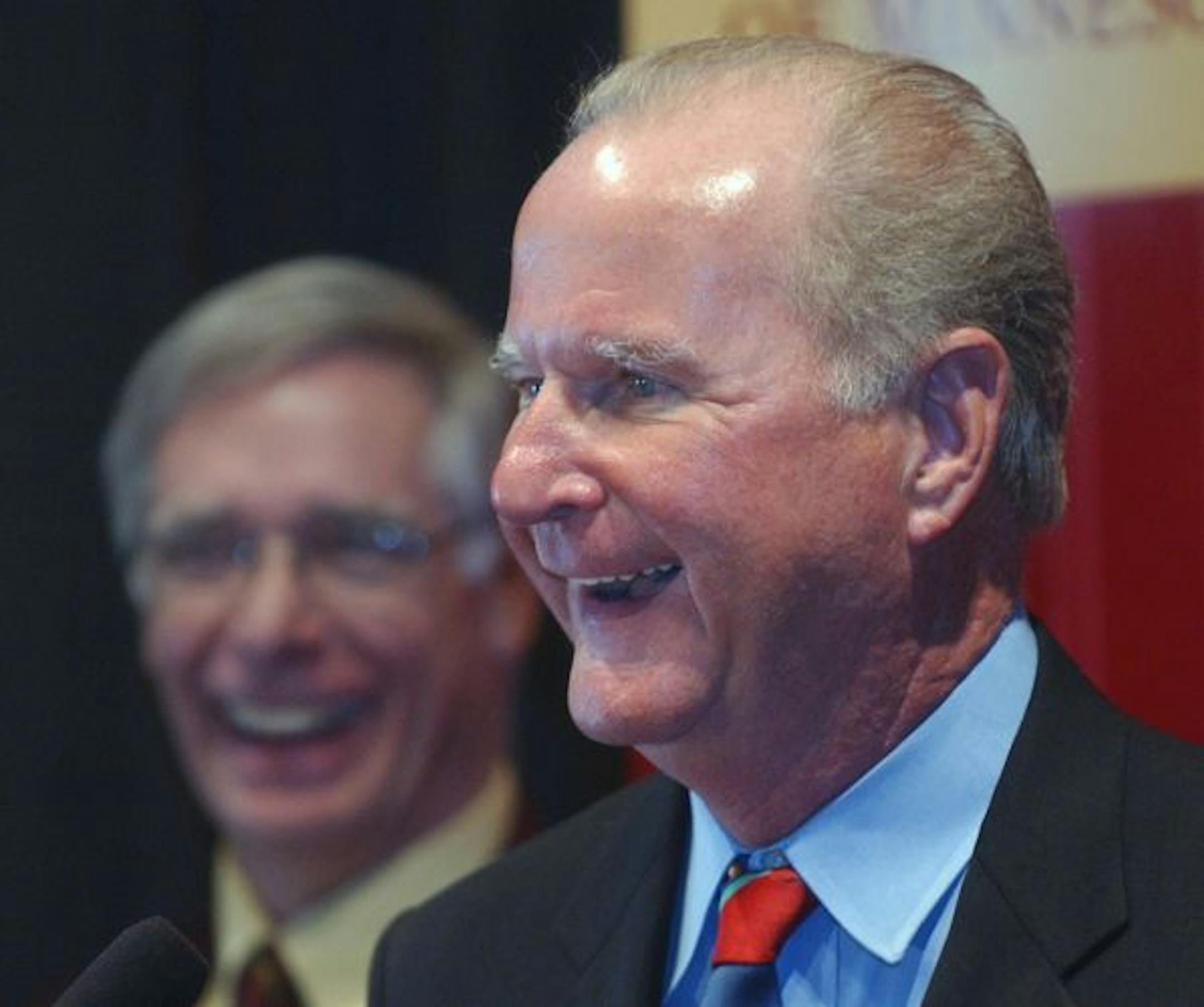 Joey McLeister/Star Tribune Minneapolis,Mn.,Thurs.,Mar. 24, 2005--(Left to right) University of Minnesota President Robert Bruininks laughs at TCF CEO Bill Cooper's remark that the 35 million dollars isn't his personal money, but the shareholders of TCF. Cooper, Bruininks and others answered questions following an official announcement at the McNamara Alumni Center complete with the marching band, cheerleaders, pompoms, refreshments and Goldy. GENERAL INFORMATION: TCF FinancialCorporation and th