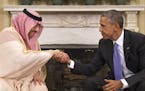 President Barack Obama shakes hands with Saudi Arabia's Crown Prince Mohammed bin Nayef during their meeting in the Oval Office of the White House in 