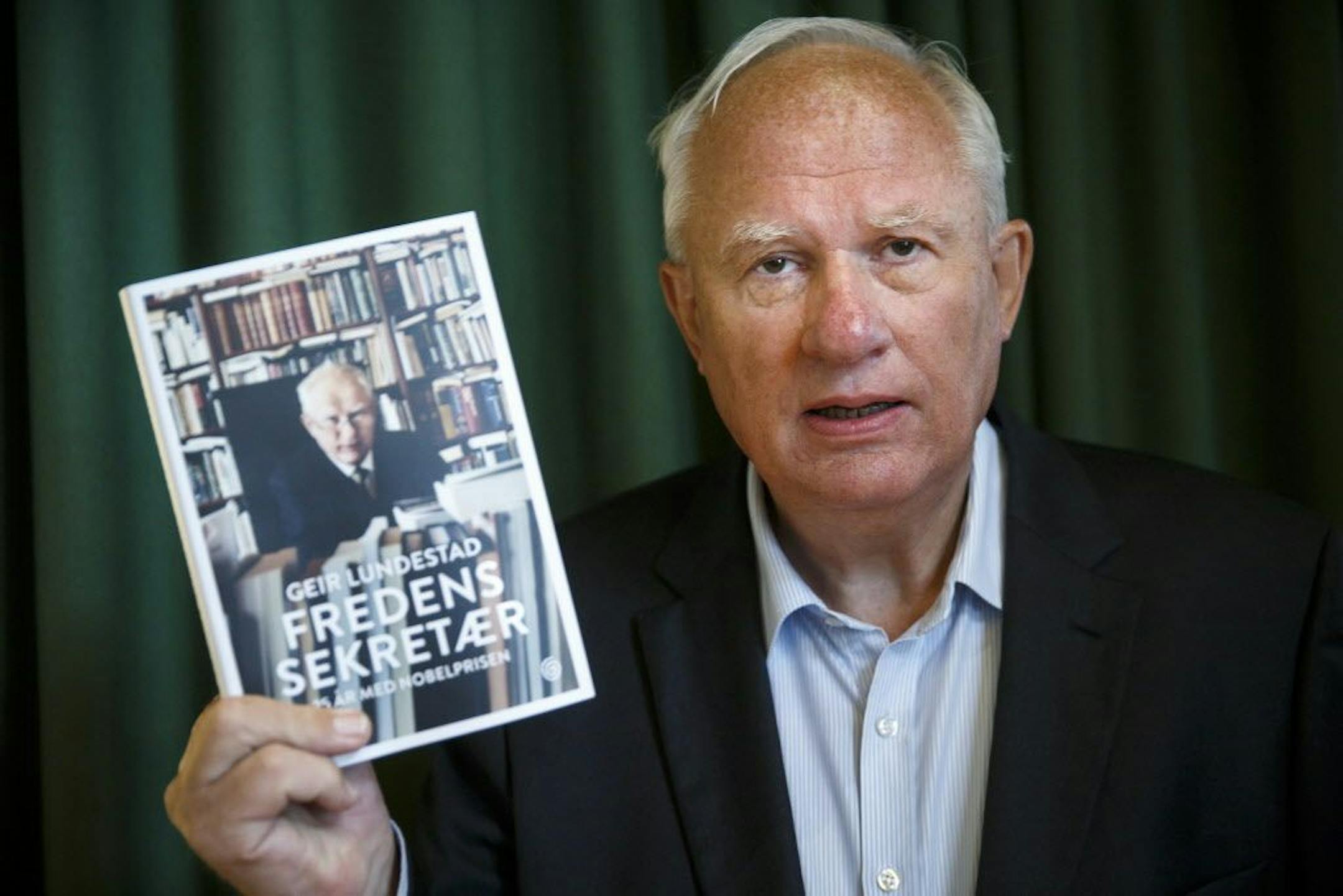 Geir Lundestad holds his book "The Peace Secretary" before launch at the Nobel Peace Center in Oslo.