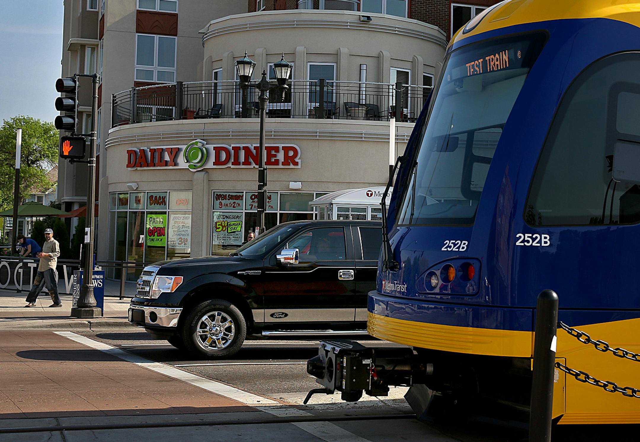 New development is apparent along the Green Line near the Dale Street station. The Frogtown Square (background) is a building that features commercial space and senior housing.