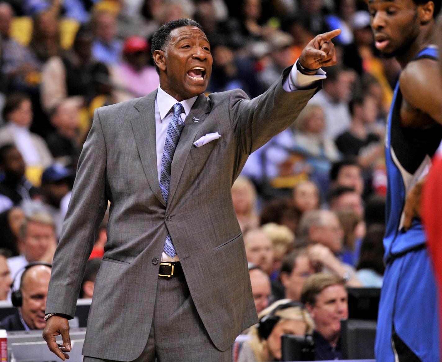 Minnesota Timberwolves coach Sam Mitchell calls to players during the first half of the team's NBA basketball game against the Memphis Grizzlies on Friday, Feb. 19, 2016, in Memphis, Tenn. (AP Photo/Brandon Dill) ORG XMIT: MIN2016022014162603