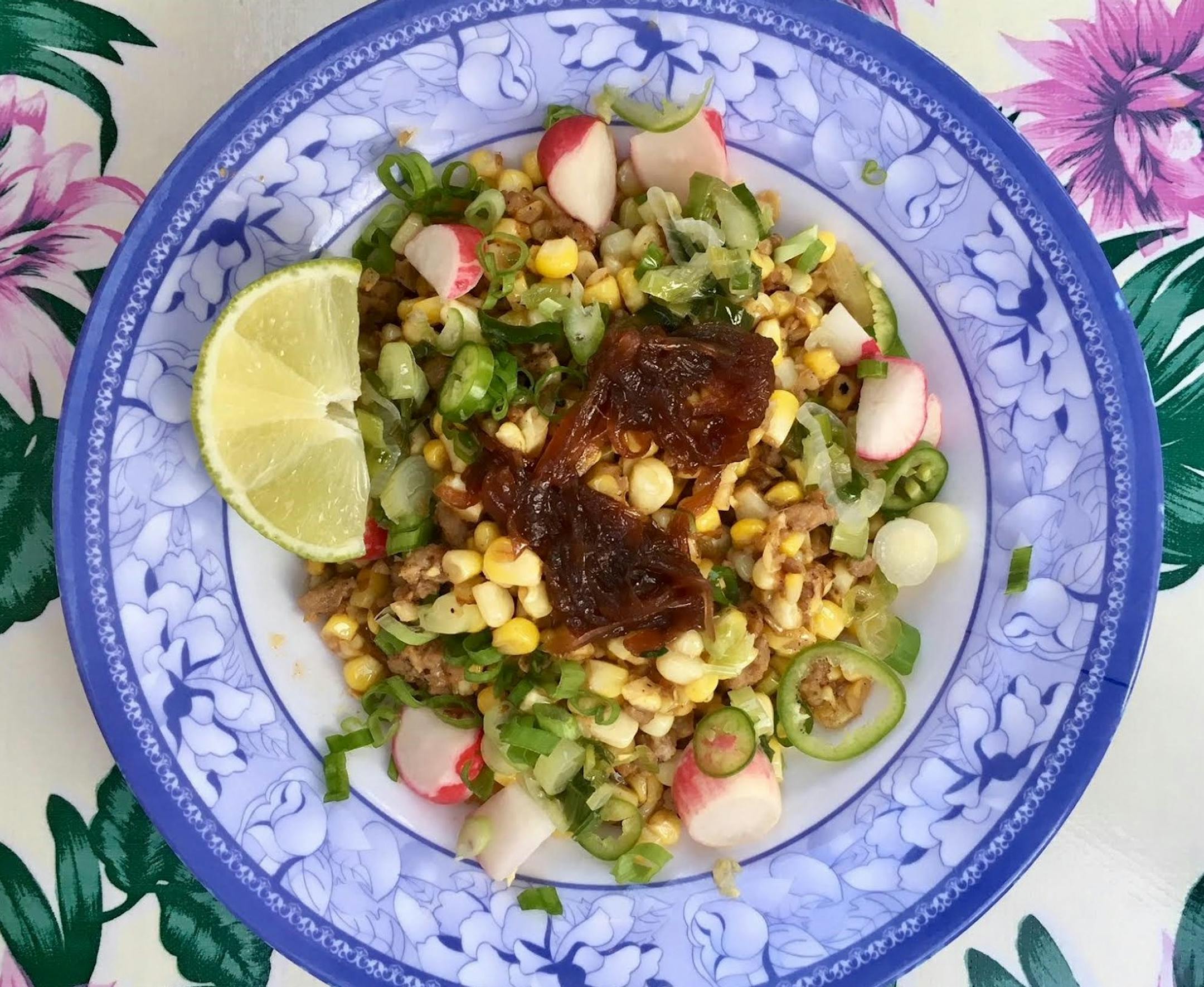 Sweet corn with shrimp paste butter, pork, scallion oil, radish, serrano, fried shallot and caramelized onion (GF) at Hai Hai.