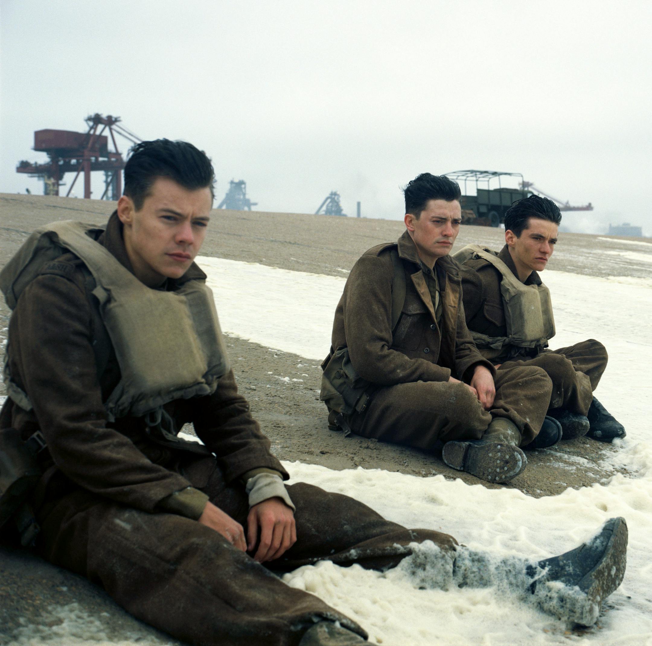 This image released by Warner Bros. Pictures shows Harry Styles, from left, Aneurin Barnard and Fionn Whitehead in a scene from "Dunkirk." Styles, 23, who gained fame with One Direction and recently launched his solo career, plays a British soldier in Christopher Nolanís suspense-thriller about the evacuation of hundreds of thousands of Allied soldiers from Dunkirk, France, in May and June of 1940. (Warner Bros Pictures via AP)
