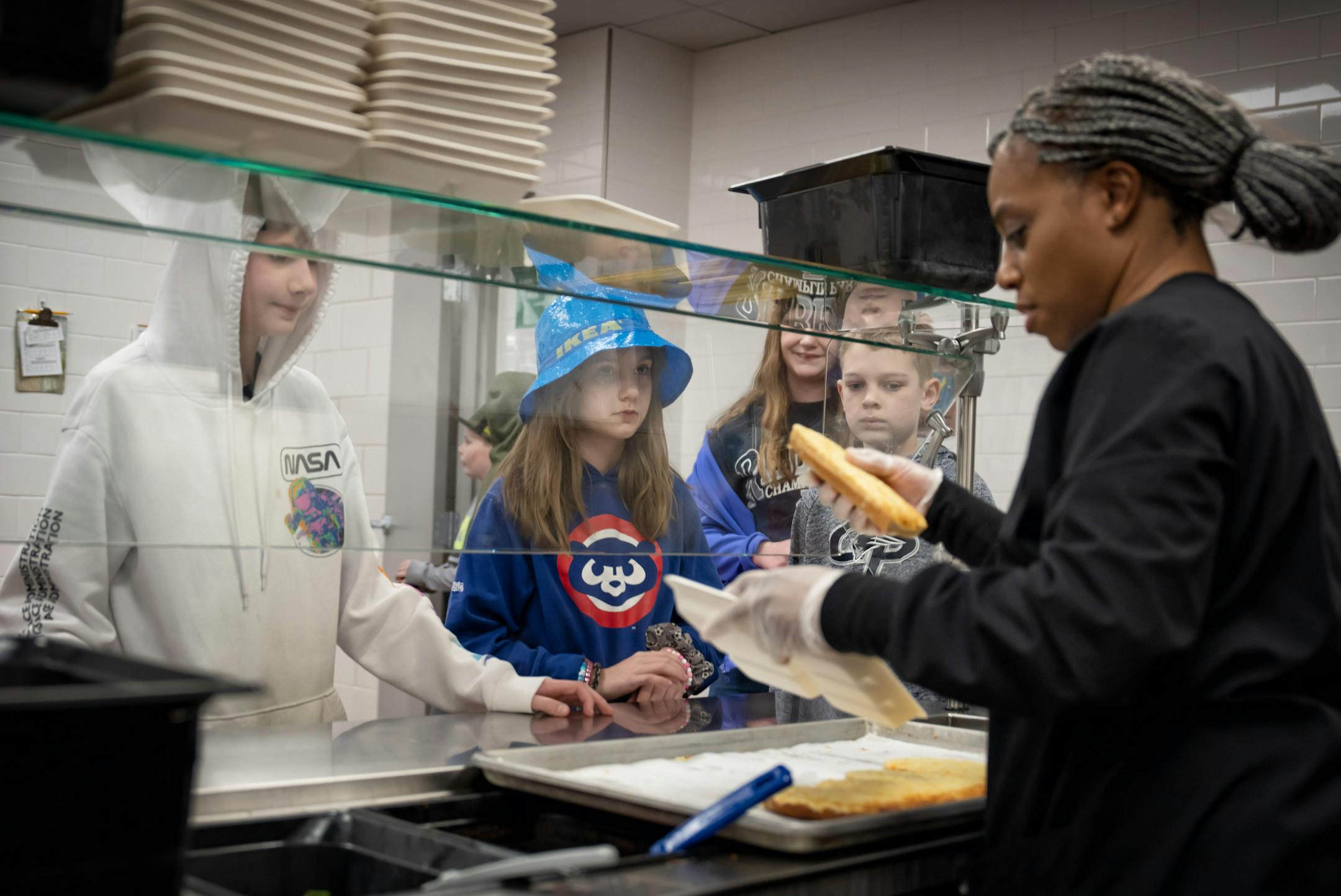 Cassandra Day served school lunch to 5th graders at Champlin-Brooklyn Park Academy on Friday, Feb. 17, 2023 in Champlin, Minn.