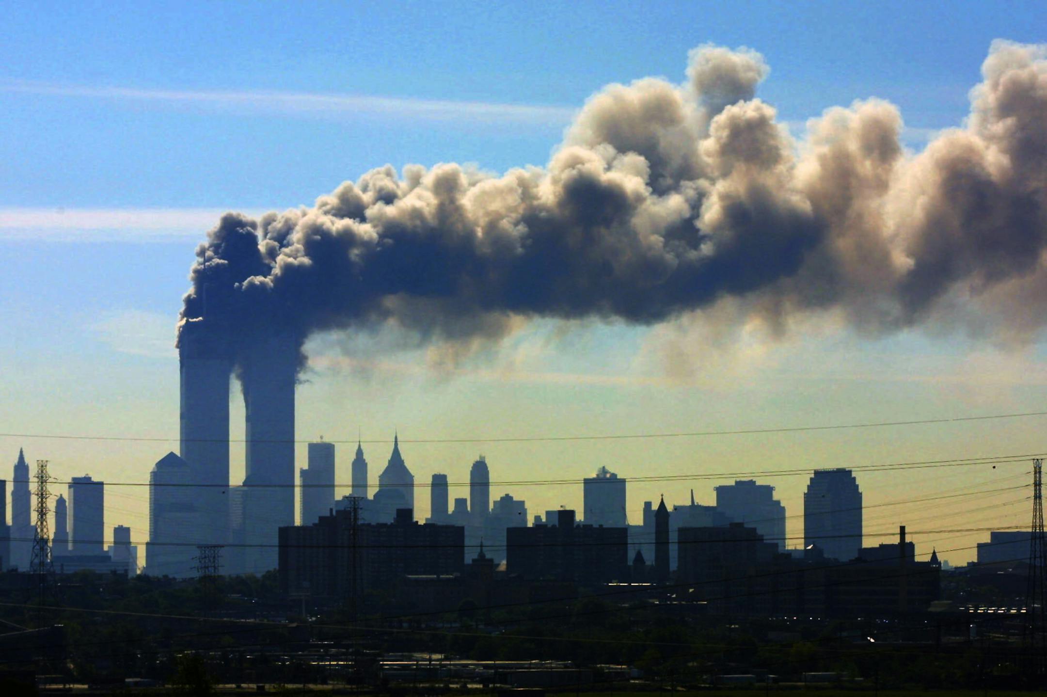 FILE - In this Sept. 11, 2001 file photo, as seen from the New Jersey Turnpike near Kearny, N.J., smoke billows from the twin towers of the World Trade Center in New York after airplanes crashed into both towers. Saudi Arabia and its allies are warning that legislation allowing the kingdom to be sued for the 9/11 attacks will have negative repercussions. The kingdom maintains an arsenal of tools to retaliate with, including curtailing official contacts, pulling billions of dollars from the U.S.