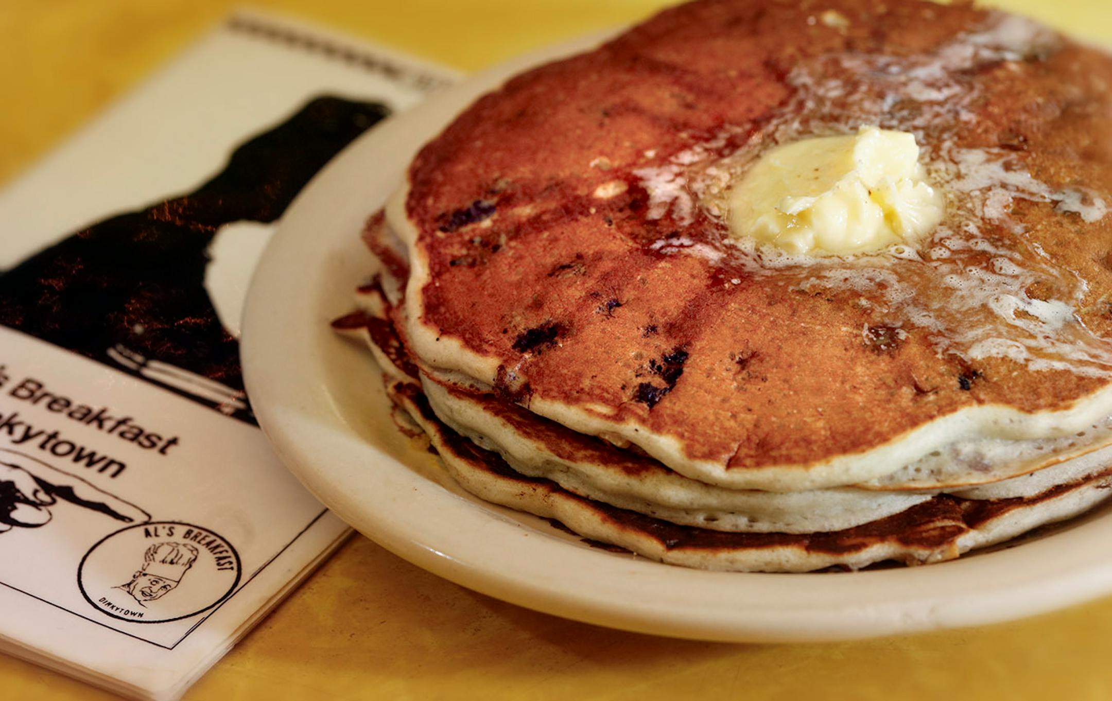 The blueberry/walnut pancakes. A changing of the guard at the institution, Al's Breakfast. Doug Grina, one of the original owners and Alison Kirwin, his new partner, at the tiny 14-seat restaurant. Some of the food they are famous for are dishes like the, blueberry/walnut pancakes, bacon waffle, and the "Jose."