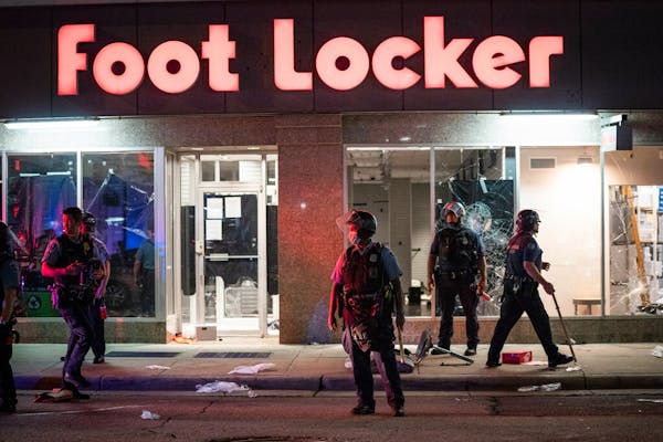 Crowds clashed with police, smashed windows and looting occurred in downtown Minneapolis on Wednesday night.