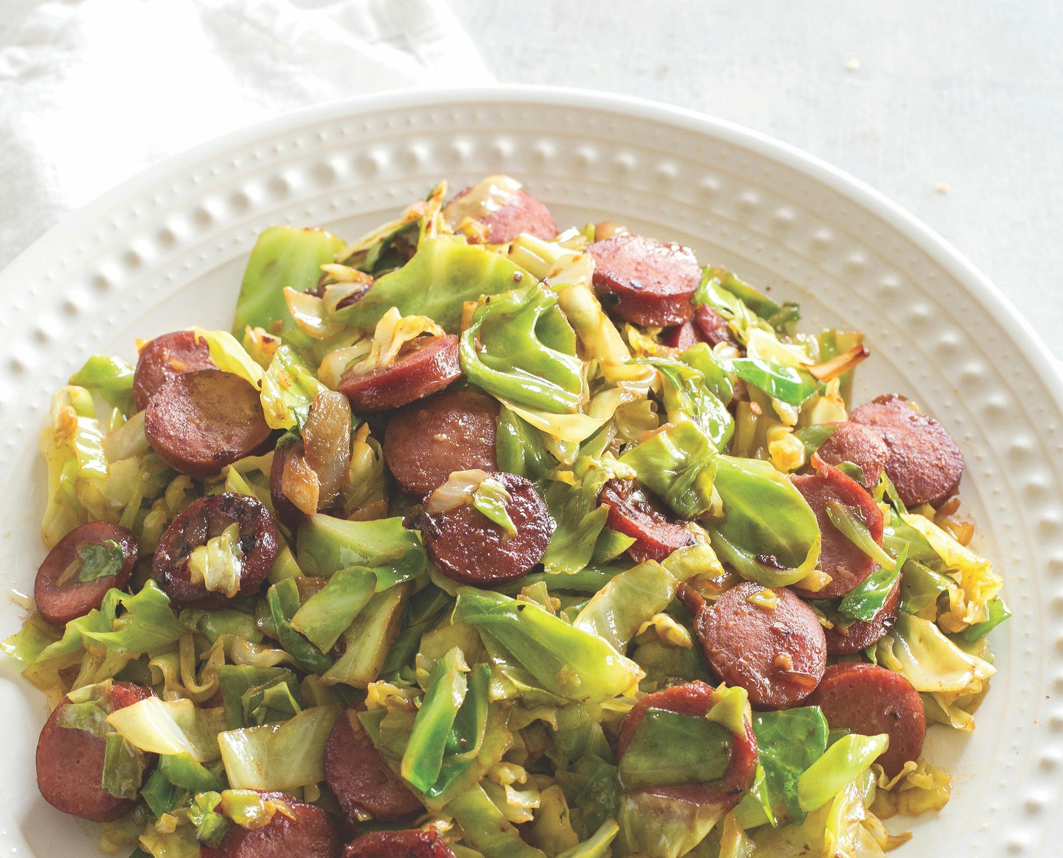 Kielbasa Cabbage Skillet. Excerpted from Scrumptious from the Girl Who Eat Everything © 2021 by Christy Denney. Photography © 2021 by Christy Denney. Reproduced by permission of Shadow Mountain. All rights reserved.