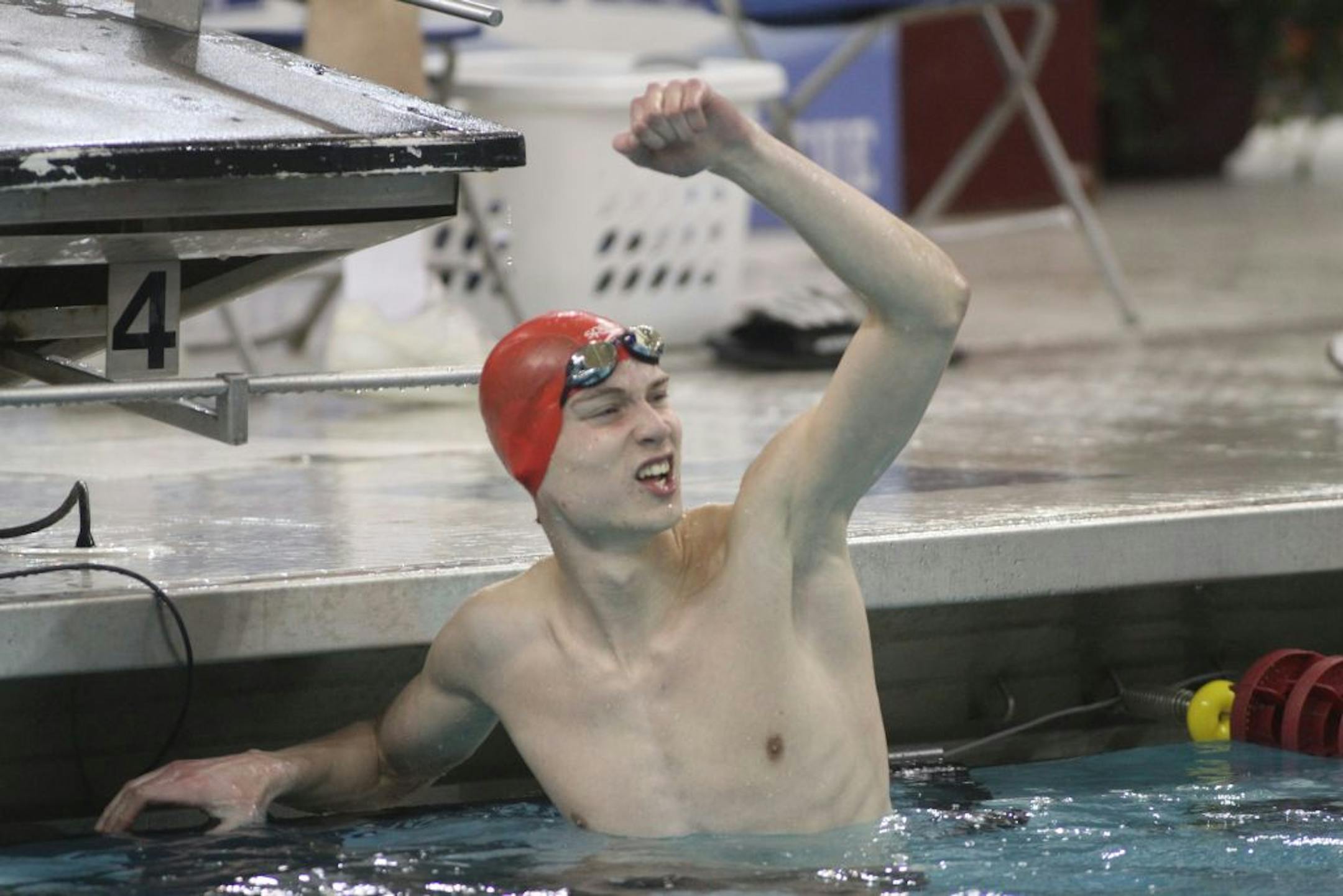 Aaron Greenberg of Eden Prairie celebrated in the water after winning the boys 200 yard freestyle relay.