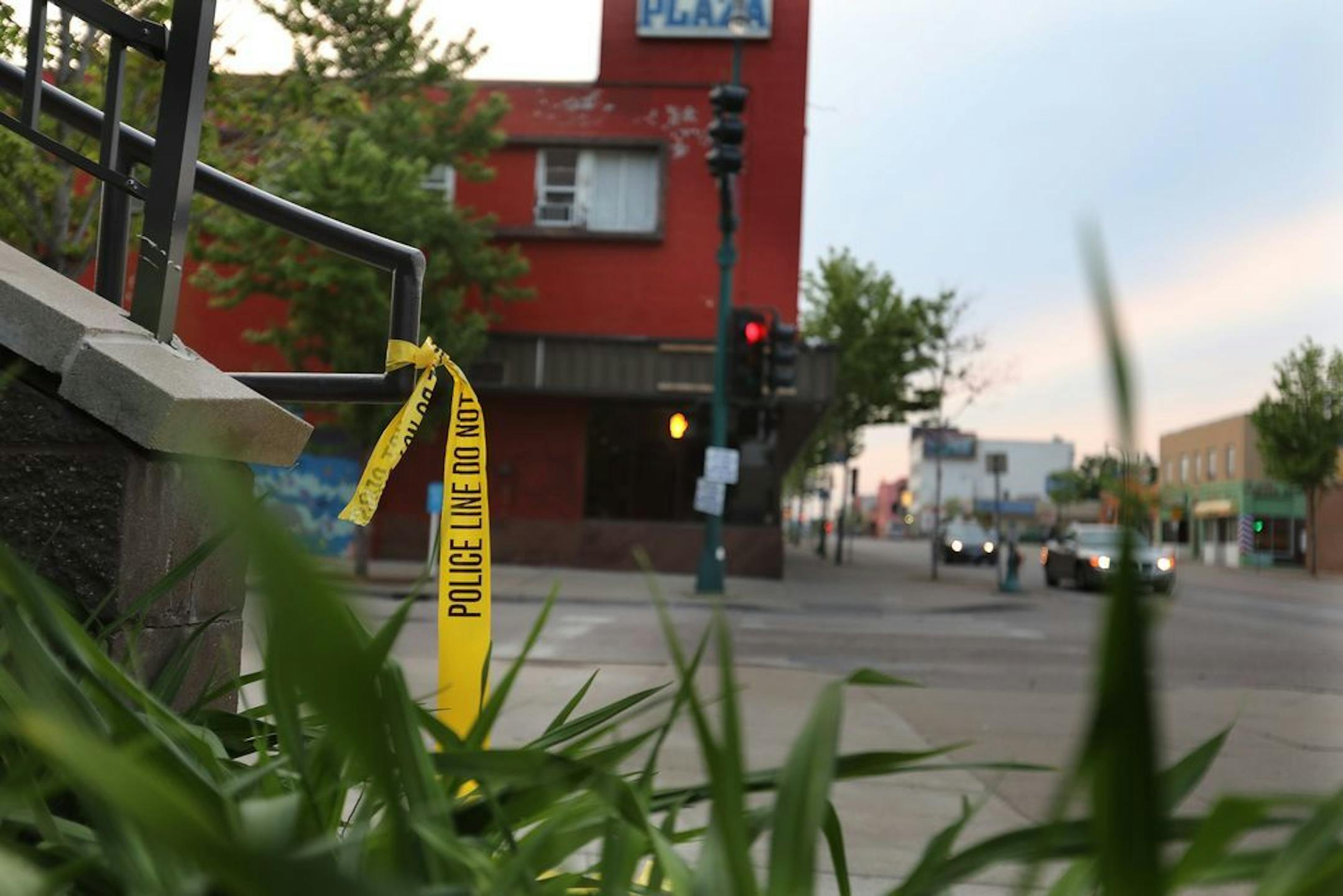 Police tape outside an apartment building at 13th and Lake Street, near the scene of an early morning homicide at 12th and Lake Street on Minneapolis' Southside Thursday, May 30, 2019.