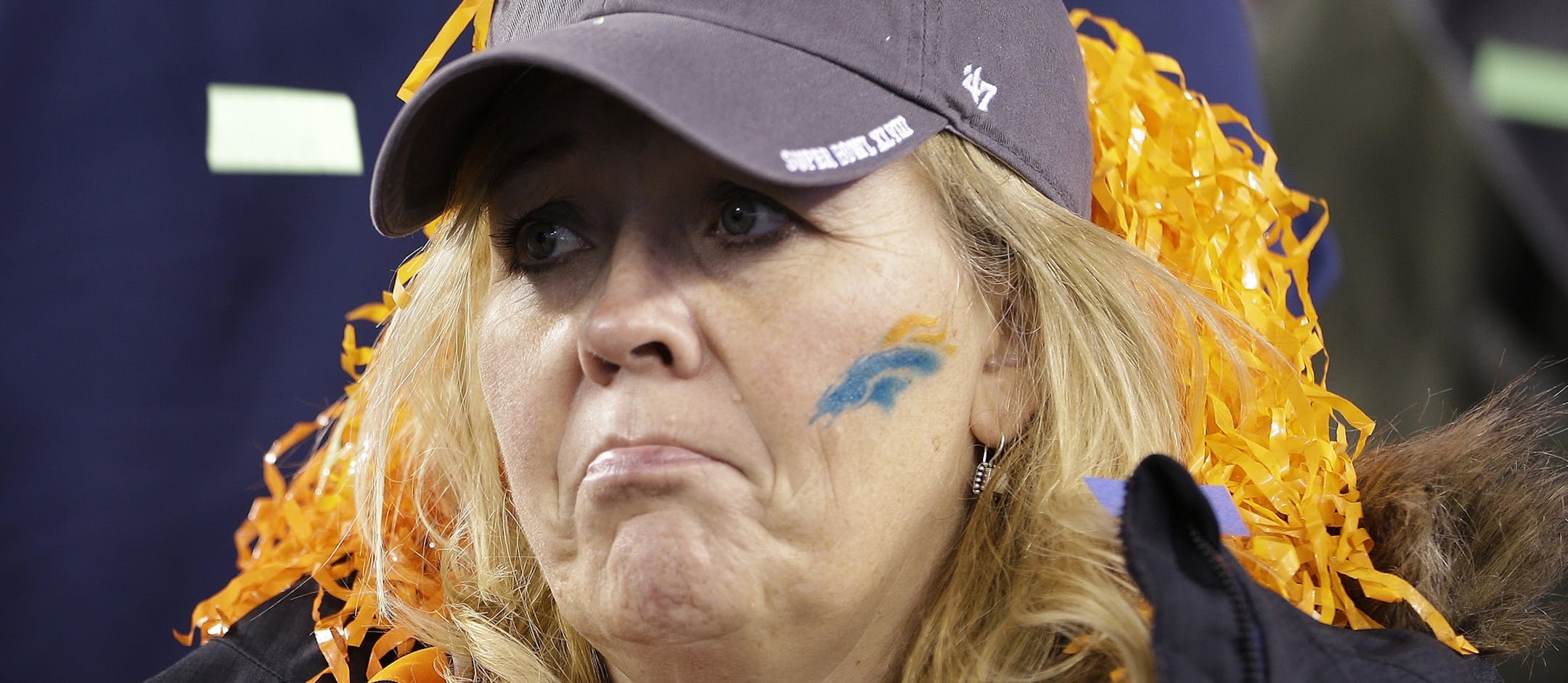 A Denver Broncos fan reacts after the NFL Super Bowl XLVIII football game against the Seattle Seahawks Sunday, Feb. 2, 2014, in East Rutherford, N.J. The Seahawks won the game 43-8. (AP Photo/Seth Wenig)