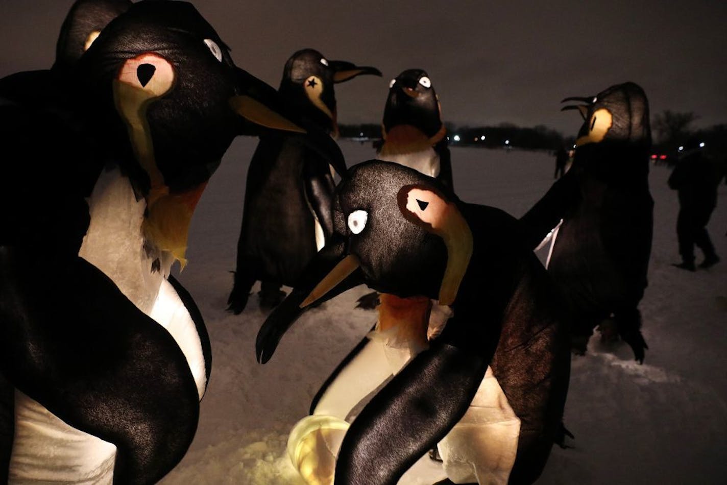 A group of glowing penguins danced around an egg as attendees of the annual Luminary Loppet watched Saturday.