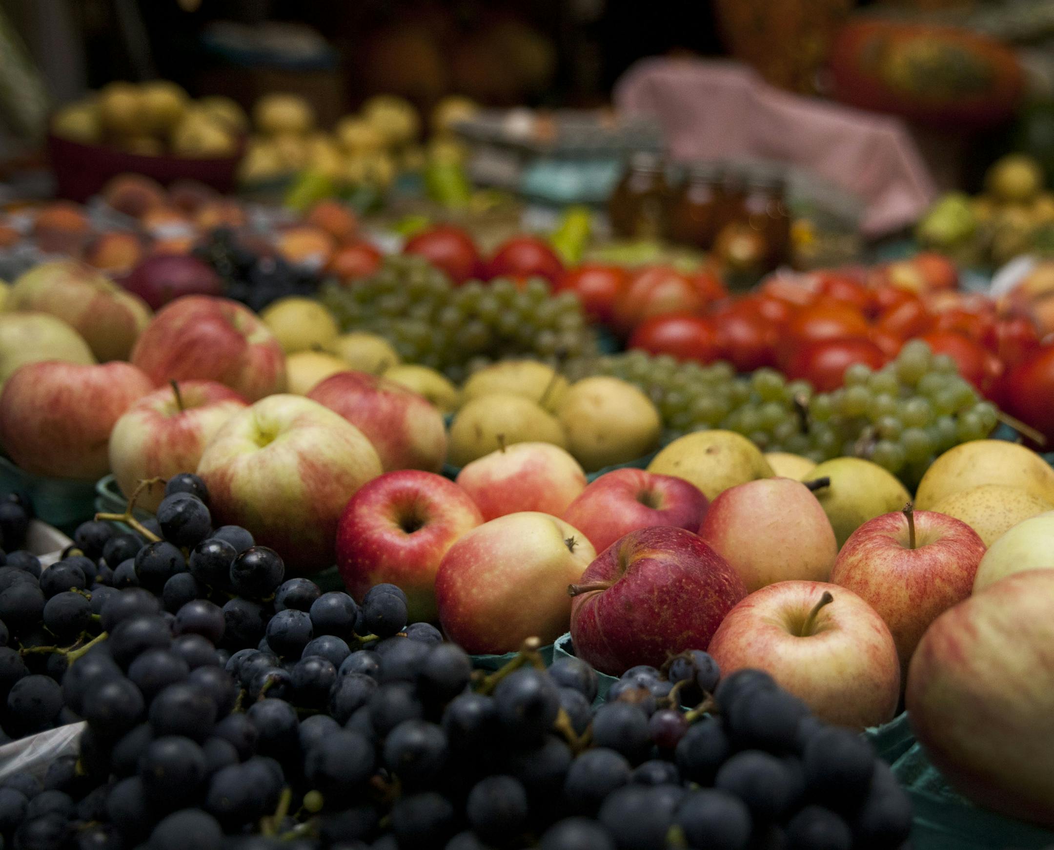 Fruit is on display as hundreds of community members turned out to support local farmers and craftsmen at the Night Market at the Kalamazoo Farmers Market Thursday Sept. 18, 2014 in Kalamazoo, Mich. (AP Photo/Kalamazoo Gazette-MLive Media Group, Katie Alaimo) ALL LOCAL TELEVISION OUT; LOCAL TELEVISION INTERNET OUT
