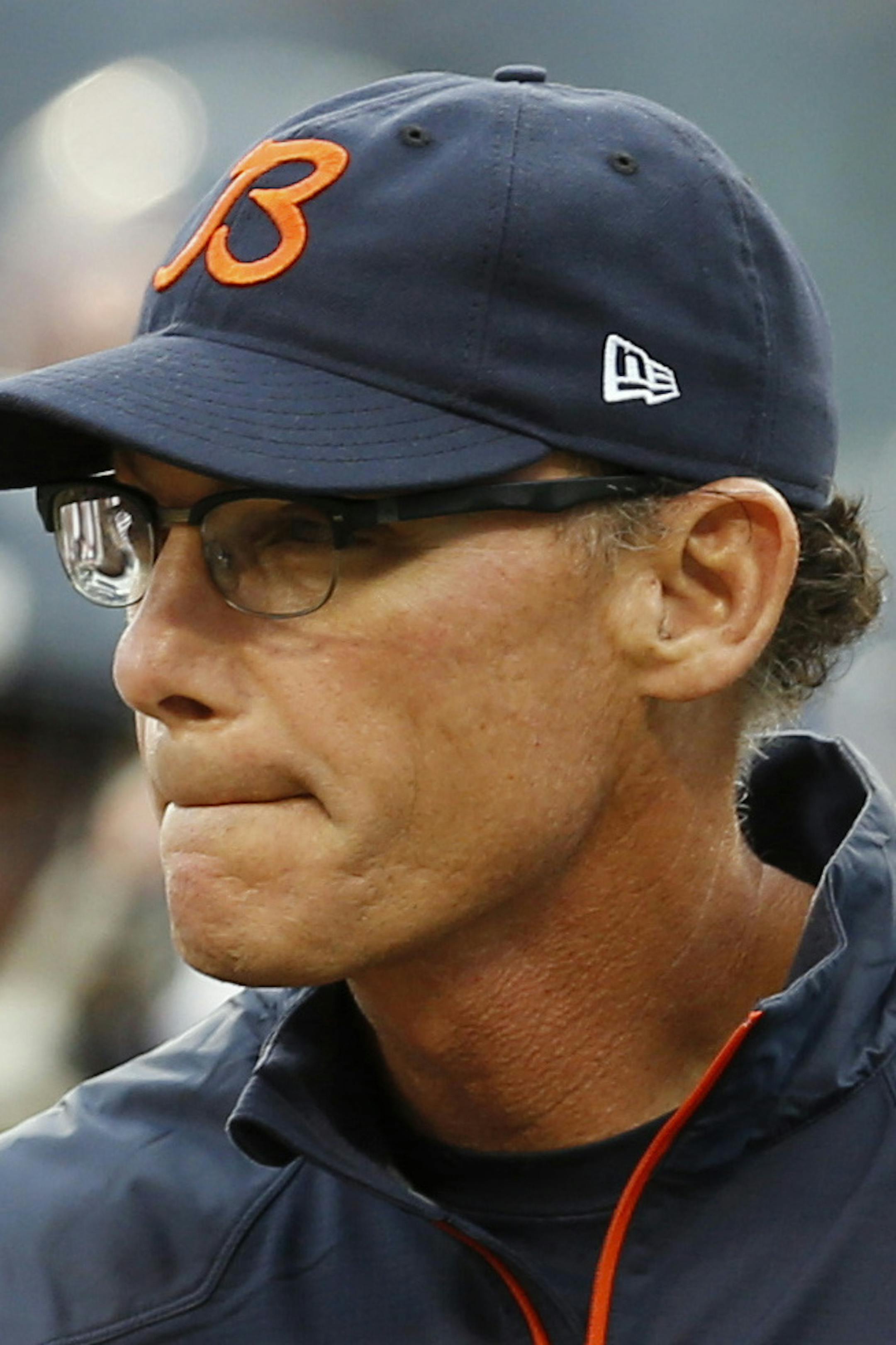 FILE - In this Aug. 15, 2013 file photo, Chicago Bears head coach Marc Trestman walks around the field before a preseason NFL football game against the San Diego Chargers in Chicago. Trestman is on the spot. The Bears kick off the season with their new coach when they host the Cincinnati Bengals on Sept. 7, hoping he can spark their offense and lead them to the playoffs after missing out five of the past six seasons. (AP Photo/Charles Rex Arbogast, File)