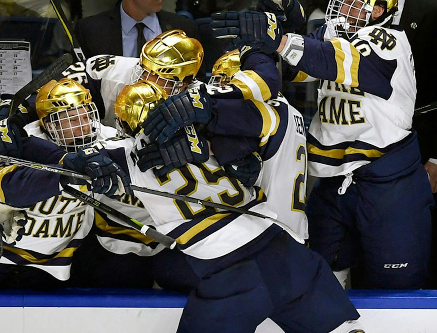 Notre Dame's Dylan Malmquist leaped into the arms of teammates after his winning goal.