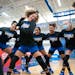 Hopkins guard Jasmine Dupree (11) dances in the middle of the girl’s basketball team huddle before playing No.1 ranked Sidwell Friends on Friday, Ja