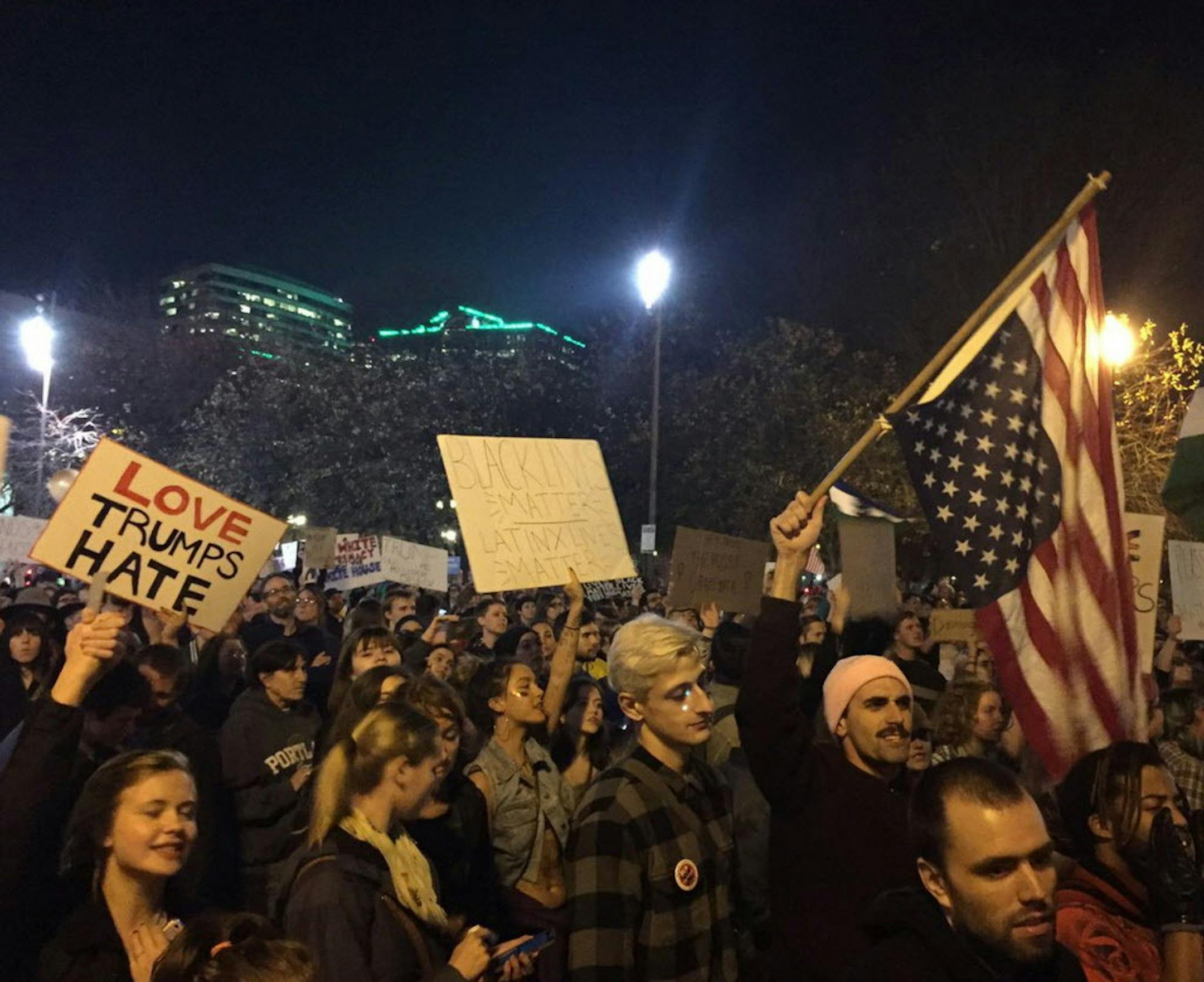 Protesters march on their way to Waterfront Park in Portland, Ore., on the third day of protests over the results of the 2016 U.S. presidential election, Thursday, Nov. 10, 2016. President-elect Donald Trump fired back on social media after demonstrators in both red and blue states hit the streets for another round of protests, showing outrage over the Republican's unexpected win. (Jim Ryan/The Oregonian via AP)